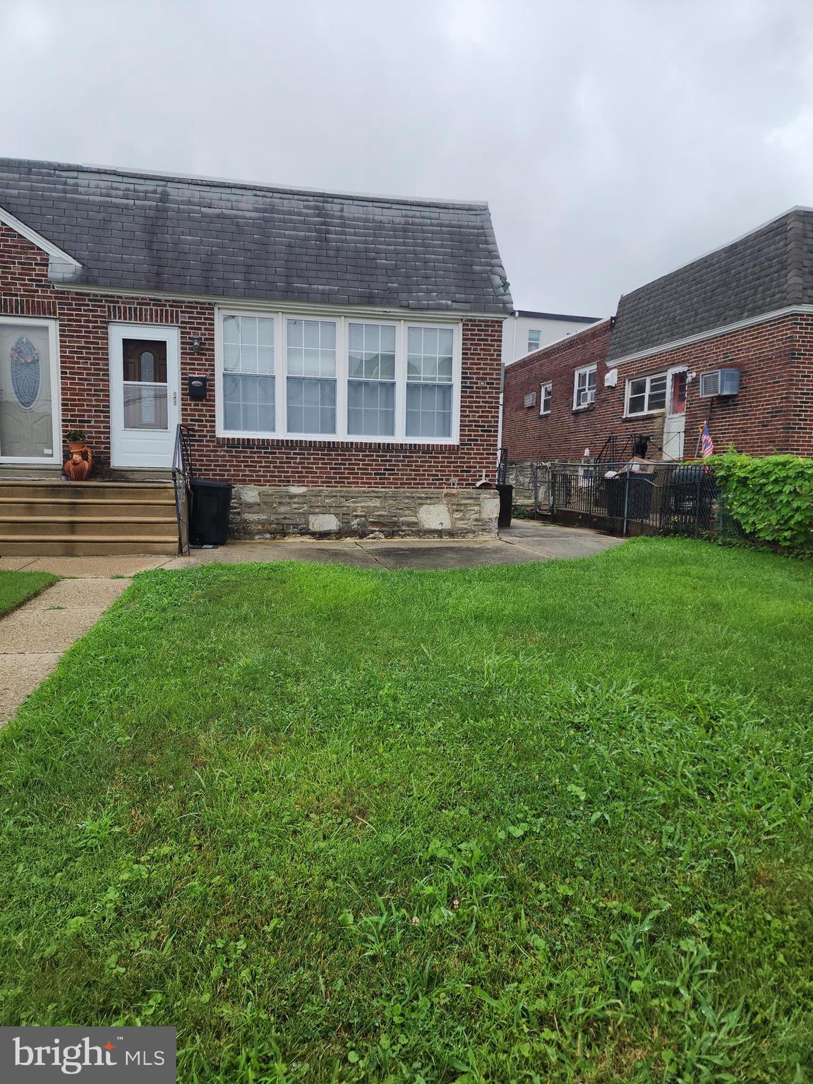 This full brick, semi detached home has one level living with 3 bedrooms and a full bath on the main level. The basement level has not been used in a while, but has an amazing family room space with bar and half bath surrounded by knotty pine walls. Laundry is in basement level with a walk out to back driveway and fenced yard. Front has a great patio space for socializing.
