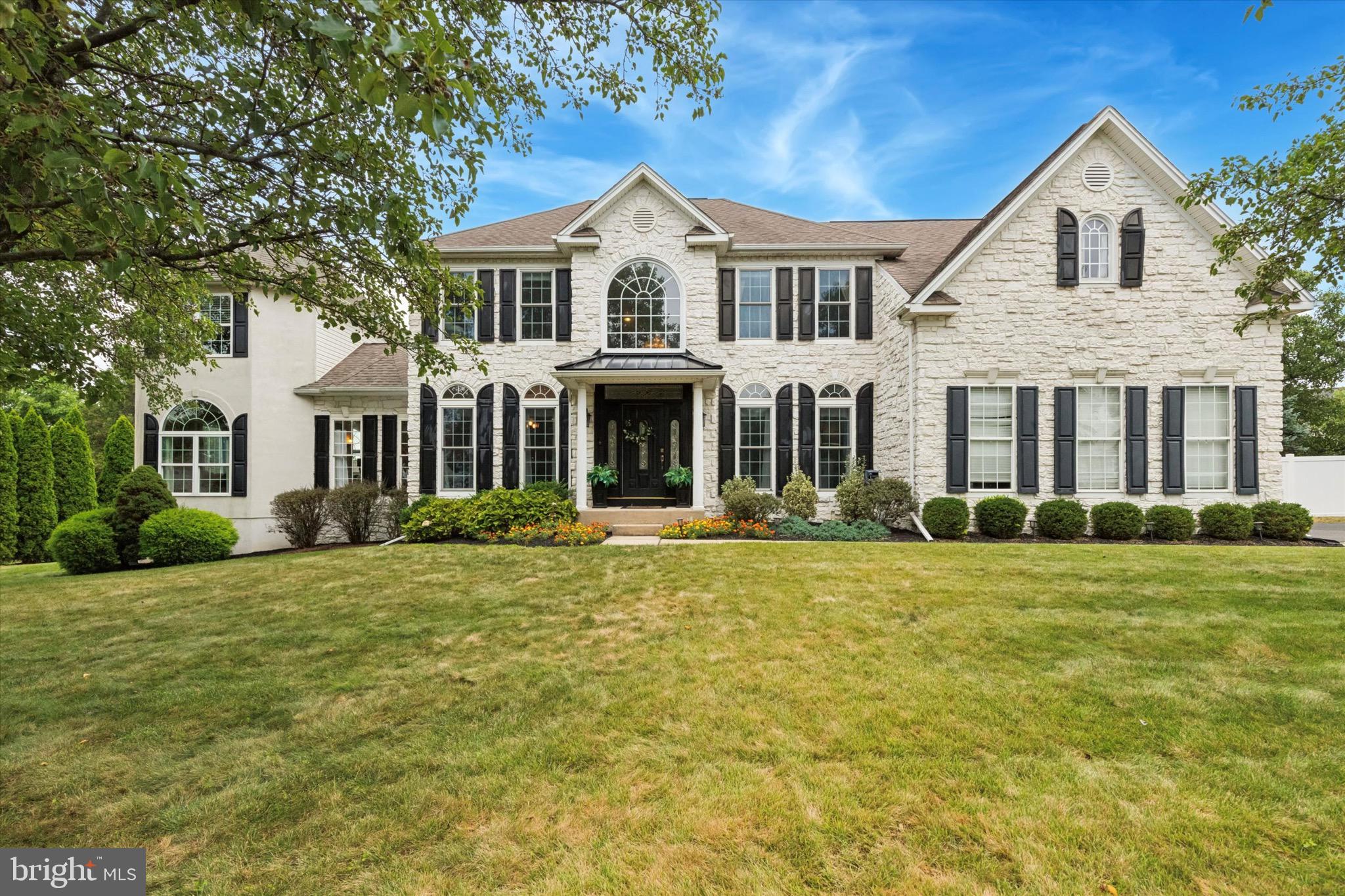 Welcome to this 4300 plus sq ft gem nestled on a corner lot in the desirable Maple Knolls neighborhood! This home is truly one-of-a-kind. It underwent a complete renovation in 2015, including electric, HVAC, kitchen, windows, and flooring. Upon entering, you’ll be greeted by a spacious two-story foyer with a turning staircase. The first floor boasts an office, dining room, living room, an oversized kitchen, two bonus rooms, a laundry room, extended two car garages, and a sun room. The kitchen features beautiful wooden cabinets, barn door pantry, a 9ft granite island, and stainless steel appliances. The family room is conveniently located off the kitchen in this open concept. It boasts vaulted ceilings and a cozy wood-burning fireplace. The entire first floor is adorned with gorgeous oversized windows. The bonus room also has three palladium windows and a spiral staircase leading upstairs to another possible bedroom or office. The first floor is completed with a generously sized sun room featuring large sliding windows. The family room also has a rear staircase leading to the second floor, which includes four bedrooms with ample closet space and ceiling fans. The master suite boasts a tray ceiling with a fan, a sitting area, and two walk-in closets. The master bath is a dream come true with a large jacuzzi tub, dual sinks, a tiled shower, and heated floors. You’ll never need extra space here! The house has two basements. The primary basement is partially finished, waiting for your choice of paint and flooring. It also has two storage rooms. The second basement is accessible through bilco doors in the backyard and is currently being used for yard supplies. The generous corner lot is a true homeowners paradise, featuring an in-ground pool, a gazebo, a patio, a deck, a sand pit fireplace, and a small putting green. It’s truly one-of-a-kind! All this within walking distance to Mill Creek elementary school and Central Bucks South high school.
