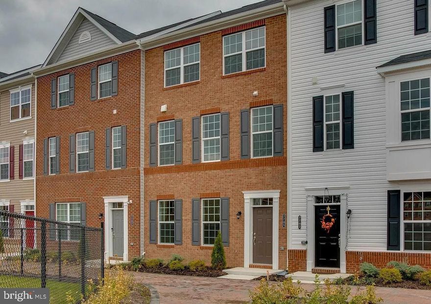 Excellent 3-level town home with 4 bedrooms,3 full  & 1 half bath,2-car garage,2640 sq. ft of living space on 3 finished levels. The first floor offers a 2-car garage, a bedroom with a full bathroom, and a closet. The second floor offers a full open floor plan featuring a living room, dining room, half bath, and kitchen with a very large center island, granite countertops tops and stainless steel appliances, and a spacious Trex Deck off the Kitchen. The third floor features 3 bedrooms and 2 full baths, including the primary suite, which also has a large walk-in closet.  Convenient laundry on the bedroom level.