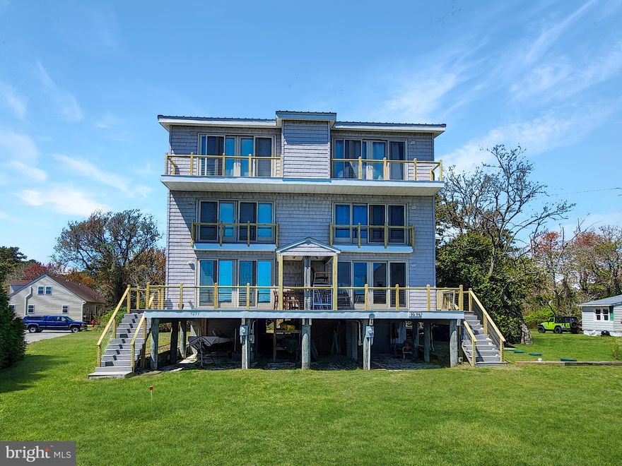 Remarkable Island Home Overlooking Assateague Island and our famous Lighthouse. This 1812 Square Feet home is sprawled out over 3 stories with the views getting grander from everyone. The 1st and main living level has all new Luxury Vinyl Plank Floors, with a spaciouse open floor plan. The modern and high end kitchen is a chefs dream with a ton of storage, work space and unlimited waterviews from the kitchen island. Off the front of the house, the large double slider opens up and brings the outdoors, sea breeze  and salt water smell right into your living room. On the backside of the house there is a nice grilling deck and spacious screened porch. You'll also find a powder room and pantry on this level. Now up to level 2, which offers a cozy TV room, a bedroom on the rear side of the house and large bedroom on the front of the house with another double slider overlooking the water. There is also a full bathroom and laundry on this level. The 3rd floor is an owners dream. This huge primary suite features a sleeping area that steps out to a private balcony with views as far as the eye can see. It also offers a bonus space that would make a great sitting area, office or addtional sleeping. The bathroom in the primary suite offers a large fully tiled shower and a custom floating vanity with a glass top and sink. This home comes with shared dock access with the neighboring home and fully furnished. You don't want to miss out on this one.