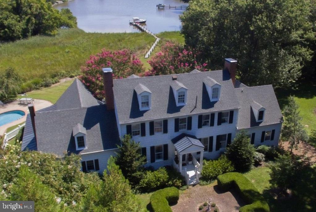 Discover the epitome of elegance and tranquility at Old Wintersell, a private retreat on Island Creek just minutes from Oxford and Easton. This 6-bedroom colonial is nestled amidst 14 acres, creating a sanctuary for abundant wildlife and unparalleled privacy. The property boasts a waterside pool, dock, pond, workshop, pump house, and extensive landscaping. Nearby amenities include fine dining, shopping, healthcare, theatres, galleries, museums, golf courses, a country club, a yacht club, and a jet airport. The property is conveniently located 1.5 hours from D.C. and Baltimore, and 2 hours from Philadelphia.