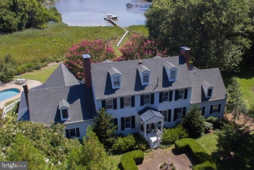 Discover the epitome of elegance and tranquility at Old Wintersell, a private retreat on Island Creek just minutes from Oxford and Easton.  This 6-bedroom colonial is nestled amidst 14 acres, creating a sanctuary for abundant wildlife and unparalleled privacy.  The property boasts a waterside pool, dock, pond, workshop, pump house, and extensive landscaping.  Nearby amenities include fine dining, shopping, healthcare, theatres, galleries, museums, golf courses, a country club, a yacht club, and a jet airport.  The property is conveniently located 1.5 hours from D.C. and Baltimore, and 2 hours from Philadelphia.