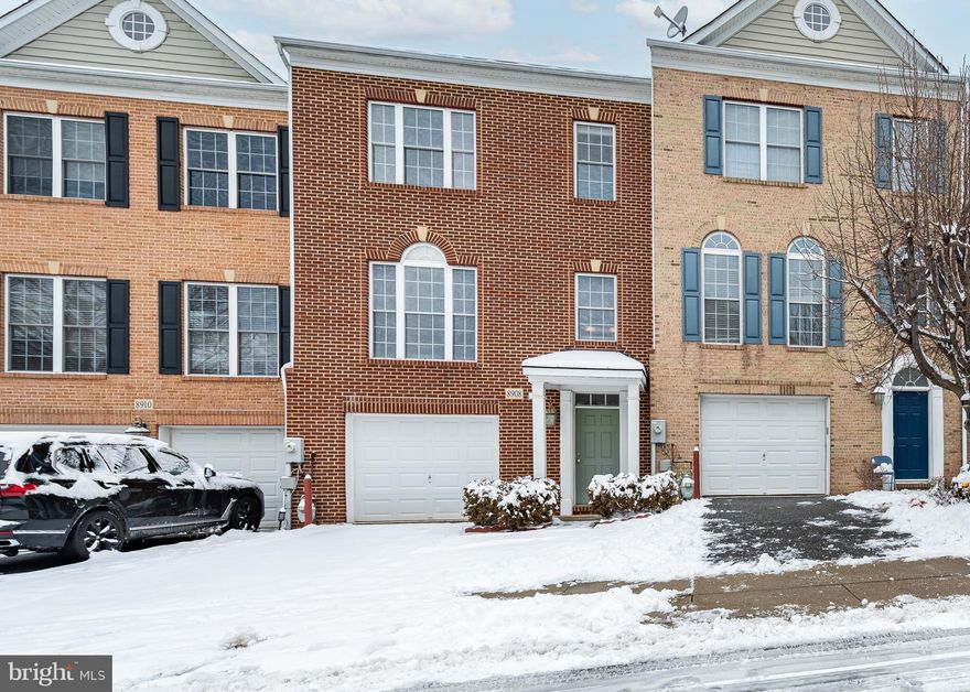 Charming and conveniently-located brick front garage townhome in Ellicott City * 4 bedrooms and 3.5 bathrooms * 3 finished levels with 2,196 square feet of finished living space * Greet guests at the front door in the ground level foyer with hardwood flooring, coat closet, garage access, and a family room that doubles as a 4th bedroom with a full bathroom * Main level open living room/dining room (with ___’ ceiling) * Eat-in kitchen with sitting area featuring Corian counters, breakfast bar, double wall oven, gas cooking, and plenty of cabinet storage * Slider to composite deck overlooking community open space * Upper level features vaulted ceilings and fabulous primary bedroom suite with walk-in closet and super bath with dual vanity and separate soaking tub * Enjoy local shopping, restaurants, and services and the commuter convenience of nearby MD-100 *