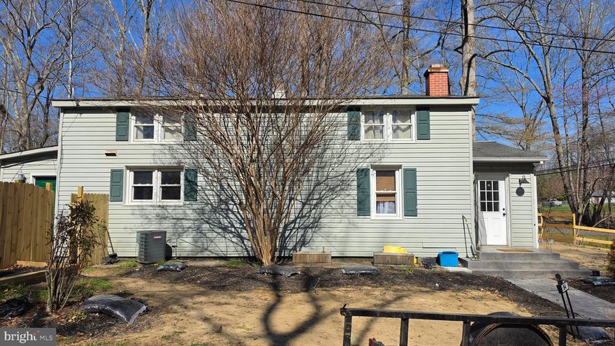 Investor Special! Fixer-upper alert in Stafford, Virginia! This versatile two-story home sits on a private lot close to Marine Corps Base Quantico and offers no HOA restrictions. Featuring four bedrooms and 1.5 baths (county records show three, but there are actually four), the layout includes a main-level primary bedroom with full bath and separate get ready area with cedar closet, for convenient single-floor living. Upstairs, you'll find three additional bedrooms and a half bath—ideal for converting into a spacious owner's suite with a little remodeling.
Inside, the good-sized kitchen provides plenty of potential, while newer flooring adds a fresh feel throughout much of the home. The living room boasts a cozy wood-burning fireplace, and the rear laundry/mudroom includes a cedar closet, with the washer and dryer staying with the property.
Outside, enjoy a fully fenced backyard complete with an operational inground pool, a pool house/shed, and a concrete patio. A carport provides covered parking, and newer stamped concrete creates an attractive sidewalk and front porch. Additional benefits include a transferable home warranty, the possibility to hook up to county sewer (currently on septic), and county water already in place.
This home is a fantastic opportunity for buyers ready to bring their ideas and sweat equity to make it shine. With its private setting near Quantico, solid bones, and room to customize, it's perfect for investors, or anyone looking to build equity through updates.