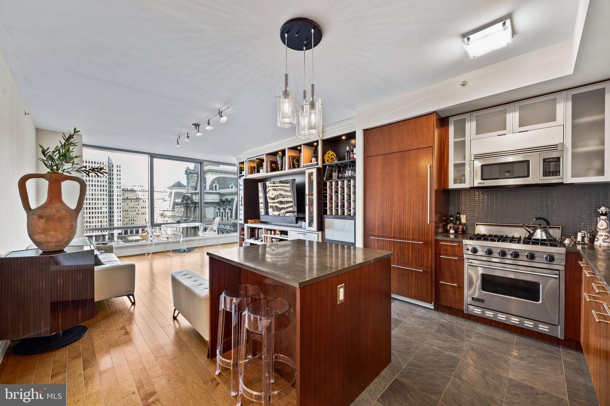 Luxury Living at The Ritz-Carlton Residences | 1-Bedroom, 1.5-Bath "D" Unit with Iconic City Hall Views
Welcome to The Ritz-Carlton Residences, Philadelphia, where world-class luxury meets modern sophistication. This stunning 1-bedroom, 1.5-bath unit offers breathtaking north-facing views of City Hall through floor-to-ceiling windows, filling the space with natural light and showcasing the beauty of the city skyline. Designed for both comfort and elegance, this residence features hardwood floors throughout and custom built-ins, providing both functional storage and a refined aesthetic. The open-concept living and dining area is perfect for entertaining, while the chefs kitchen boasts top-of-the-line appliances, sleek cabinetry, and a spacious layout for culinary enthusiasts. The primary suite is a private retreat, offering a spa-like ensuite bath with designer finishes, a soaking tub, and a glass-enclosed shower. A convenient half-bath adds to the units appeal, making it ideal for guests. As a resident of The Ritz-Carlton, you'll enjoy five-star amenities, including a 24-hour concierge, valet parking, state-of-the-art fitness center, indoor pool, residential lounge, and private garden with a serene waterfall feature. Located in the heart of Center City, you're just steps from fine dining, high-end shopping, and cultural landmarks. Don't miss this opportunity to experience unparalleled luxury and service at one of Philadelphia's most prestigious addresses. Schedule your private showing today!