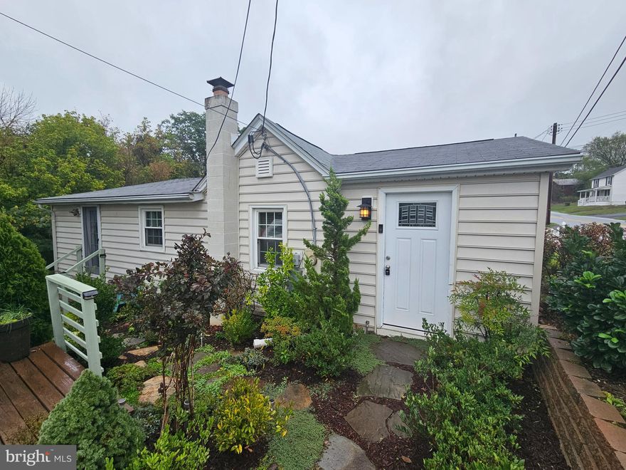 Welcome Home to this updated cute Gem that was completely updated in 2011 close to downtown Frederick with no city taxes,  This single family home one level living boasts many updated including a newer Kitchen with SS appliances, full bath,  fresh paint and Luxury flooring.  The open plan features a cozy Living Room and Dining area with vaulted high ceilings.  2 Bedrooms and updated bath.   Parking for 2 cars.    Enjoy the refreshing nights in the large back yard with patio and fire pit. Septic inspected and pumped in 2021. Close to Frederick and commuting routes.   This is a must see,   Possible assumable loan and or qualifies for 100% USDA or VA financing and  grant money available.