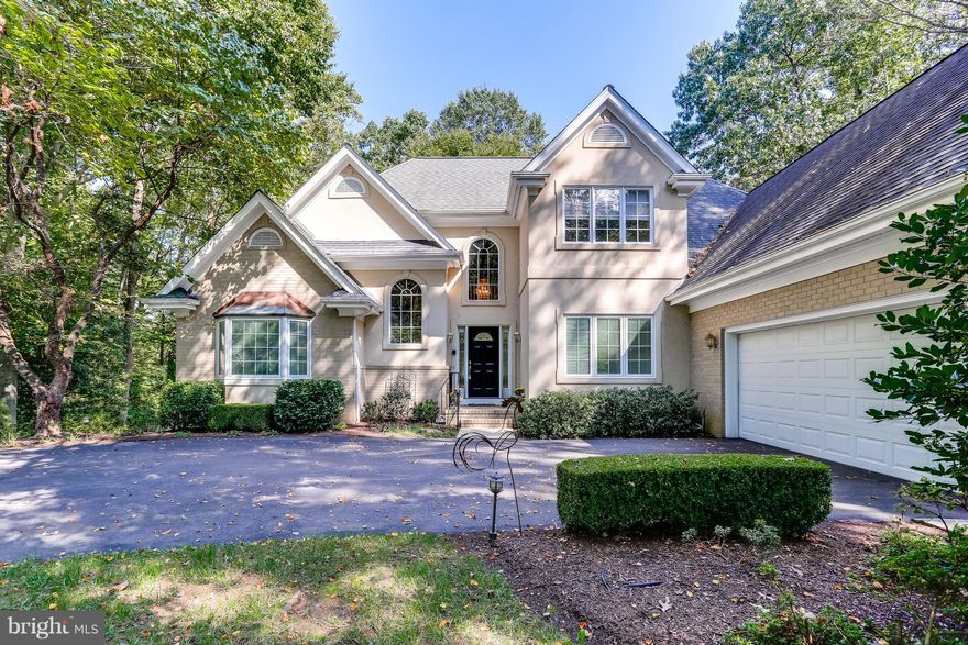 Beautiful Custom Built Home in coveted water privileged Belvoir Farms with Master BR on main level.  Loads of privacy located at the end of the street on a cul-de-sac and walking distance to path leading to the water privileges. Enjoy your fenced yard and deck plus a large covered gazebo. Family room boasts cathedral ceilings, built-ins + wet bar. Mud room features large doggie bath area!