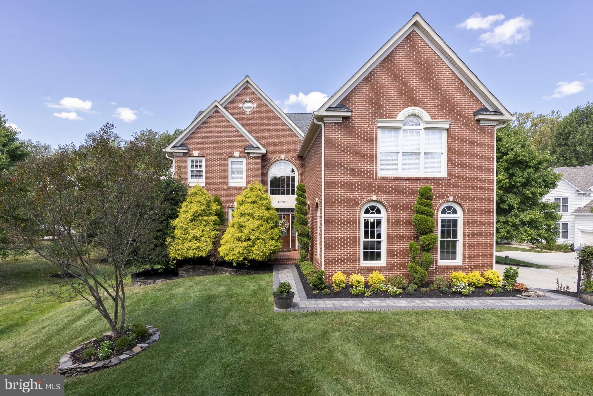 Welcome to 10205 Deep Skies Drive - an exceptional, meticulously upgraded home in the sought-after Emerson community of Laurel. Custom built and thoughtfully enhanced by the original owners, this 6 bedroom/4.5 bathroom residence boasts one of the largest floor plans in the neighborhood, with every detail updated for modern living. From major systems to high-end finishes, the work has already been done—offering a turnkey home. The main level offers a welcoming two-story foyer, formal living and dining rooms with classic trimwork and arched entryways, a renovated designer kitchen with center island, pantry and eat-in space, a sunroom opening to the deck, a spacious family room with gas fireplace, and a private home office with custom built-ins. Upstairs, the luxurious primary suite includes a massive walk-in closet with center island and chandelier and a spa-like bath with heated floors, steam shower, soaking tub, and dual vanity. Three additional bedrooms are on the upper level including a Jack & Jill style bathroom between two bedrooms, and one bedroom with vaulted ceilings and an en-suite bathroom. A convenient and spacious laundry room is also on the upper level. The newly remodeled walk-out lower level expands the living space with a large recreation area with bar/kitchenette, two full bedrooms, a modern full bath, a wine/bonus room, and direct access to the backyard. Major improvements include renovated kitchen and baths, roof and gutters, HVAC, water heater, sump pump with backup, whole-house speaker system, and upgraded flooring and lighting throughout. Exterior features include extensive stone landscaping with lighting, an in-ground sprinkler system, and a three-car garage. Nestled on a peaceful wooded backdrop, this turnkey home is set within Emerson’s amenity-rich community featuring a clubhouse, pool, tennis courts, trails, parks, and year-round social events, with easy access to Baltimore, Washington, Annapolis, and Fort Meade! Don't miss this beautiful and spacious home!