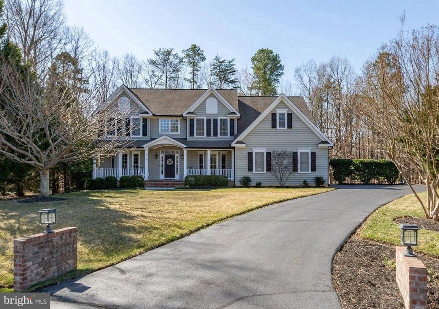 Charming front porch colonial sitting on a beautiful 1 acre property on a quiet cul-de-sac with mature trees and a short distance to the many Fawn Lake amenities. Half a block away from a playground with a summertime splash pool! This home is fully updated and ready for you! The gourmet kitchen, with porcelain tile floor and stainless appliances, has an informal dining area and opens to a sunny family room with a gas fireplace surrounded by a wall of beautiful custom built-ins. You will love the large screened porch and adjoining deck just off the family room that overlooks the private backyard surrounded by nature. Also on the main level is a formal dining room, a private office, formal living room and a powder room.  Dual staircases take you upstairs where there are four bedrooms and three full baths including a huge primary bedroom with a large sitting area.  The primary has a room sized walk-in closet and an updated luxury  bath. There is also a laundry room conveniently located on the bedroom level. The basement has been recently custom finished and includes a full bath, a media room, a second office, a gym, a kitchenette and a storage room. This home has many upgrades including an oversized garage, extra wide driveway, 6" gutters with gutter guards, 2 new sump pumps , in-ground irrigation, one HVAC replaced in 2022 and the other in 2017, a new water heater, 4 exterior Ring cameras and a cozy 2nd deck area for your firepit.  Make this home yours now so you can enjoy summer at the Lake! ****The gated Fawn Lake community is one of a kind with it's own lake, marina and beach for boating, fishing, and swimming, an award winning golf course, 2 lakefront restaurants, tennis, pickleball, playgrounds, miles of walking paths, a community pool overlooking the Lake, fitness center, clubs and activities for all ages and more! Highly rated schools and convenient to Fredericksburg and Rt 95, or work from home while living in this beautiful resort style community.