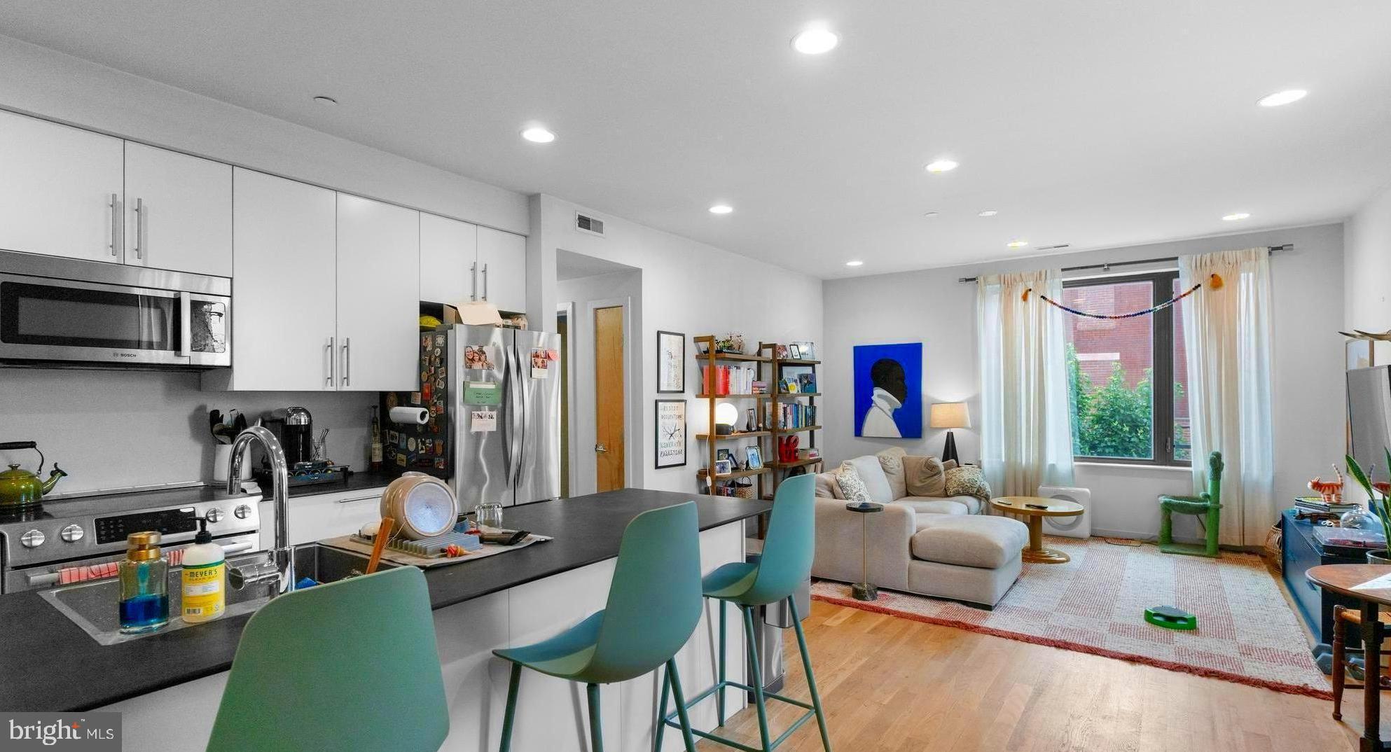 Want a condo with parking but wanna stay in South Philly? Here’s a rare availability at reNEWBOLD - a modern community development in tranquil Newbold neighborhood with eco features and amazing finishes. Constructed in 2016 and built to LEED-Platinum standards, the 18-home and 2 unit community at 16th & Moore pairs insulated walls and green roofs & surfaces with a condo fee around $200/year, which is extremely low compared to other developments, and every unit gets its own deeded parking spot! The appreciation of the development and its limited availability speaks for itself.
Loved by neighbors, Little Susie’s Coffee & Pie is just a 1-minute walk away, and you can get coffee & freshly baked pies. South Philadelphia Tap Room and Second District Brewing are just a few blocks away, while the celebrated dining corridor on East Passyunk Avenue sits about a ten-minute walk away. The Broad Street Line (Tasker-Morris) is a six-minute walk, putting Center City seven quick stops away. Grocery options, pocket parks, and bike routes fill in the daily-life picture, so the car can often stay parked. This is a beautiful location for people to reside in.
When you walk into the unit, you will be treated by the beautiful open-floor concept kitchen with a massive peninsula, dining & living areas. Because it is a corner unit, you have tons of natural light coming in through those big windows facing North & East. The kitchen has Bosch appliances, quartz counters, and a breakfast bar. Living & dining areas have plenty of space for entertaining your guests & family.
When you walk down the hallway, you will see the first bathroom, washer & dryer, and two bedrooms, which sit on opposite ends for privacy. Both of them face West, and the first bedroom has a private bathroom. Throughout the unit, you have beautiful hardwood floors. City taxes remain minimal through the 2026 tax-abatement year.
Sustainable construction, ultra-low carrying costs, parking, rapid appreciation of the development & neighborhood, and a walk-everywhere South Philly address—1800-2 S 16th St #B makes everyday living refreshingly simple. Currently tenant-occupied till July 31, 2025! Tenant pays $2295/mo rent currently, so keep in mind that you can rent out without issues, too! Reach out to schedule a showing!