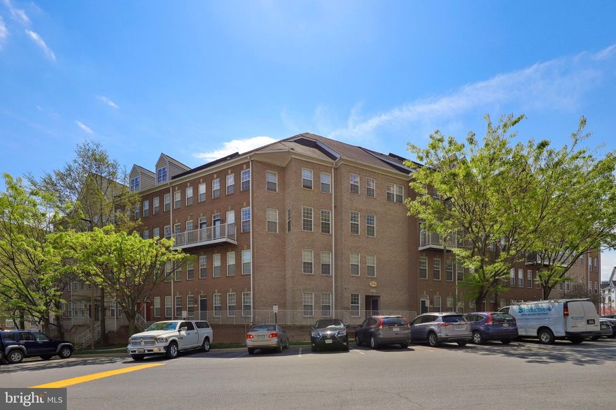 This Stunning light and bright two level condo across from Dunn Loring Metro really shines! Fresh Paint throughout. Main level has open concept living with new LVP flooring, granite counters and newer appliances in the kitchen, added recessed lights, built in bookcases, 1/2 bath and door to balcony. Upper level has 2 bedrooms, 2 full bathrooms and a laundry room (washer/dryer is 2019). Ceiling fans were added for additional comfort. Large primary bedroom has walk-in closet and en-suite with large, oversized tub and standing shower.  Building has secure entry and 2 garage parking spots (#3&4). Community includes fitness center/clubhouse. Short walk to Mosaic District, numerous restaurants, shops, grocery, gym, INOVA primary care, park, W&OD Bike Trail and more. This is the ONE!