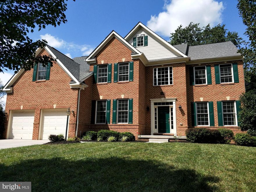 HUGE PRICE REDUCTION ($20k) for Quick Sell!!! Gorgeous brick-front colonial single-family home on a quiet street, about half acre lot with a total of 5600SF finished area, a short walk to Patapsco State Park! Main level seamless hardwood floors with two story foyer and family room, stone fireplace, and a main level office. Kitchen features a center island, beautiful new granite countertop and new stainless steel appliances, with a separate dining room. Two stairways lead to the upper level with all hardwood floors, 4 spacious bedrooms and 2 full bathrooms with an upstairs overlook into foyer and family room. The huge master suite boasts a separate sitting area, huge walk-in closet and a luxury master bathroom. Finished basement provides 1700SF of additional space for living and recreation, including two rooms, a full bathroom, a bar and more. Huge patio in completely fenced backyard. Perfect location near major routes, restaurants, shopping, excellent schools, and close to historic Ellicott City. This home is move-in ready!