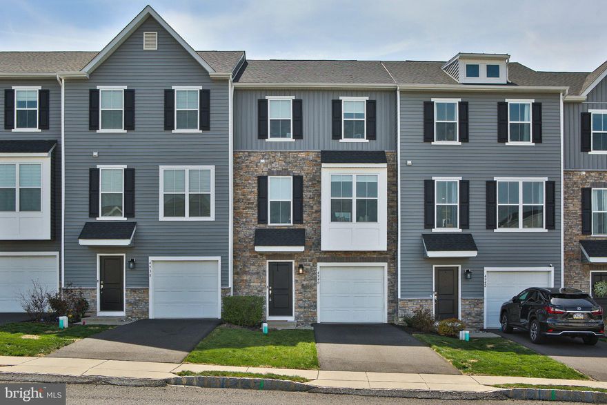 WOW! Fantastic “ALMOST NEW” 3-bedroom, 4-bathroom (2 FULL & 2 HALF) three story townhome in sought-after Brookside Court at Upper Saucon is now available. Instant CURB APPEAL with modern color siding, stone exterior and window dormer. The entry level is fully finished and features a family room, powder room and garage access. The family room is a great place to relax and watch the Phillies game or catch up on your current Netflix series. This space would also be a great place for a game room or home office. The 2nd floor features open floor plan with plenty of natural light. Large E/I kitchen with 42” cabinets, quartz countertops, HUGE island, stainless steel appliances and loads of recessed lighting. The separate breakfast room or dining area has a sliding door to the maintenance free deck. This area is ideal for enjoying your morning coffee or a glass of wine outdoors. Great room has a custom-built window seat and 3 windows that allow the sunlight to pour in. A second powder room completes the level. Durable laminate wood plank flooring runs throughout the lower level and main level. Upstairs you will find a large master bedroom with walk-in closet, ceiling fan and ensuite bath. Two other bedrooms, another full bathroom and convenient 2nd floor laundry. SOUTHERN LEHIGH SCHOOL DISTRICT! 1-car attached garage with driveway parking. Easy access to RT 309, I-78, 663 and PA turnpike. This one won’t last. Make your appointment today. OPEN HOUSE scheduled for SUNDAY 4/26 from 12 – 2 PM. Truly a special place to call home.