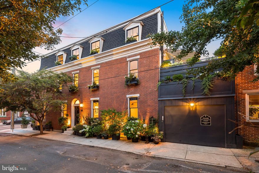 A design-driven showcase of sophistication and class, this home has flexibility in functionality from single family home, to single family with au pair or guest quarters, to duplex - all are possibilities at 718 S 22nd. Designed with only the most tasteful materials and quality craftsmanship, every square foot of this residence is photo worthy and memorable. Anything but your typical "white box" renovation, this home exhibits a soothing colour palette complemented by hints of bold contrast and metallics. Subtle accents found in the hardware and fixtures give a subtle nod to the home's historic qualities. 

Framed with foliage, the gloss black Pemberton St. door opens to a complimentary black/white Ann Sacks marble foyer and historic staircase with an exposed brick wall on the second floor landing, leading to the 2 bed, 2 full, and 1 half bath upper residence (which can be easily connected to the lower unit if desired). A grand living room with custom crown molding and millwork, original wood floors opens to the central stairway. Opposite the stairs, the rear of the property is outlined in windows and houses the open kitchen and bar with Subzero refrigeration, Bertazzoni range, designer lighting, and custom cabinetry, plus soapstone countertops, Rohl antique brass faucet, and a custom mirrored bar with china storage and wine refrigeration. A generous dining space leads to a grand terrace with ivy walls and views of the Center City Skyline. Upstairs, find two generously sized bedrooms, each en-suite (one with dual vanity and radiant floor heat), and a laundry closet. Skylights and windows on three exposures keep the space light and airy. 

Via the 22nd St. entrance, a chic and unexpected living space with 11.5' ceilings, white-wood floors, and brass accents, joins an open kitchen with a beautifully tiled wall in gloss white, reflecting both the natural and ambient light about the space. The kitchen is equipped with a Bertazzoni appliance package, gas cooking, slate floor tiles, and windows on two sides. Continue through the hallway, where a coat closet and a laundry closet meet the bathroom. The bedroom walls in Phillip Jeffries grasscloth, meet random wide plank pine floors, creating layers of texture and dimension. Lighting and sound are controlled through 'Brilliant' smart home controls. 

Additional highlights include Emtek hardware, solid core doors, Marvin and Anderson windows, designer lighting throughout, Lutron lighting controls, exposed brick, custom millwork, access for roof deck build-out, and much more. With more improvements than can be noted, this is a must-see property. This thoughtful property is one of a kind and has a partially finished basement for storage, plus a one car garage. Showings by Appointment Only.

More photos to come.