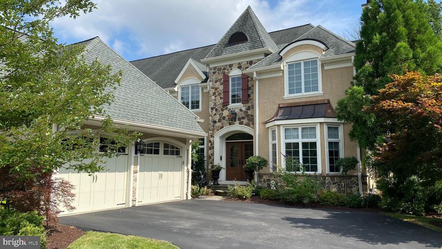 One of the premier properties in the community, this stunning “Pembrey” model home in the Haverford Reserve has every imaginable upgrade.  It is elegant, yet warm and welcoming - graced with designer finishes and state of the art features including a Lutron system, Control4 automation that provides central and remote access to all home entertainment systems, window shades, security, HVAC and spa controls.  Safety and convenience are assured with the 6-camera security system and an elevator serving all levels. (Vibe - Coco Chanel and the Jetsons create a HGTV dream home.)
The interior is bathed in light from oversized windows. The dramatic 2-story foyer with honed marble flooring and raised paneled wainscoting provide a breathtaking entry to this awe-inspiring home. After your jaw drops as you look through the double archways off of the foyer into the formal Living Room with a cast stone gas fireplace and coffered ceiling, you can turn left and walk through an elegant Dining Room with trey ceiling, fabulous glass chandelier and adjacent Butler’s Pantry with beveled mirrored backsplash, sink and wine fridge or go straight through the beautiful hallway with barrel ceiling.   Either way you will be delighted when you arrive in the Kitchen, which is the heart of the home.  
 The Gourmet Kitchen is outfitted with everything a chef would want.  An eight-burner Thermador gas range with a steam oven, Thermador double wall ovens, a full and a half dishwasher, as well as an oversized Sub-Zero refrigerator. These fabulous appliances are topped with a gorgeous marble countertop and backsplash and surrounded by both open and closed shelving and an appliance garage.   Adjacent to the Kitchen is a lovely breakfast room and a beamed, vaulted ceiling Great Room with skylights, large cast stone gas fireplace plus two sets of French doors out to the brand-new rear deck with privacy and beautiful view of the Reserve.
Adjacent to the Great Room are French doors that open to the handsome Home Office/Library featuring a rich mahogany decorative ceiling and built-ins suited for the most accomplished executive.   The main level is complete with a cheerful Powder Room and a multi-functional Mudroom with custom built-ins. Step out of the Mudroom into the attached 2-car garage with raised racedeck flooring and plenty of storage.
Back inside, you can take the graceful staircase or elevator to the upper level to get to the three bedroom suites and a convenient second floor laundry room.  Double doors access the sumptuous main suite with a vaulted-ceiling bedroom, his/hers fitted walk-in closets and a barreled ceiling hallway to the lavish white marble Bathroom featuring his and hers vanities and heated floor. The additional Bedrooms, also, have ensuite Bathrooms and custom closets.
The spacious day-lit walk-out Lower Level is a haven for all with a huge recreation room, linear gas fireplace, 80" TV with surround sound, fully equipped bar/kitchenette, Exercise room, 2nd Laundry Room, steam room, sauna and doors to the rear terrace with an in-ground spa. This space is SO well thought out – imagine finishing a dopamine releasing workout, throwing your workout clothes directly into the washing machine and then taking a steam shower or sauna before heading out to the invigoration of the spa pool that is surrounded by the gorgeous, private views of the nature preserve. You feel like you are at a five star resort every day!
 In summary, high ceilings flooded with natural light; wide plank walnut flooring, elegant fireplaces, a magnificent Kitchen, great entertaining spaces, expansive main suite, luxurious baths, a spa experience lower level and gorgeous outdoor areas make this the ultimate dream home with a “lock and leave” lifestyle in a friendly and prestigious community.  
Haverford Reserve is a community of 100 luxury carriage homes located in the heart of the Main Line amidst 124 acres of preserved land, walking and bike trails.