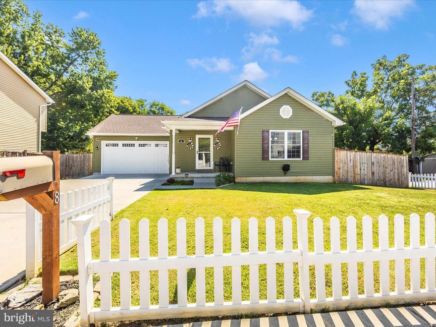 Charming Rancher with Modern Flair in the Heart of Downtown Brunswick!

Welcome to this stylish and nearly new single-family ranch-style home, built in 2019 and loaded with curb appeal. The eye-catching green siding, white picket fence, and expansive wood privacy fence framing the large, level backyard create a welcoming first impression—and finding a yard this flat and spacious in Brunswick is a rare treat!

Step inside to discover a bright and airy open-concept layout, with soaring cathedral ceilings enhancing the spacious feel of the family room and kitchen/dining area at the front of the home. A central hallway leads you straight through to the back deck and fully fenced yard—ideal for outdoor entertaining, gardening, or simply relaxing in your own private oasis.

Off the main hallway, you'll find a separate corridor to the laundry area and attached garage for easy everyday living. Two generous secondary bedrooms and a full hall bath are located on the right, while the left side of the home is dedicated to the serene primary suite, complete with a private bath and ample closet space.

But the real showstopper is the fully finished basement—an entertainer's dream or creative haven! Enjoy movie nights in the rec room with a built-in screen (which conveys), work out in the cozy home gym, host guests in the private 4th bedroom, or let your imagination run wild in the professionally finished music studio—perfect as a game room, home bar, pool room, or office.

Ideally situated in downtown Brunswick, this home offers walkability to the local brewery, shops, restaurants, and more. Don’t miss your chance to own this unique gem that blends modern comfort with small-town charm!