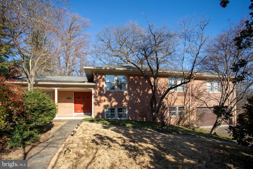 Spacious, expanded, level entry home in Kenwood Park with a lovely front porch. The free flowing main level floor plan includes the Foyer, Living/Dining Ell, table sized Kitchen and a skylit, cathedral ceiling Family room. Upstairs (half a flight) you'll find four bedrooms, one of which is a Fabulous Primary Suite with awesome "new" Primary Bath and Sitting room. Stylishly updated Hall Bath too! Bright, spacious rooms in a versatile floor plan for every need.<br/><br/>The next level down  from the main (half a flight) has a huge, bright room with gleaming hardwood flooring, the second fireplace and a built-in wet bar. Sliding glass doors lead to a rear patio and there are large windows for lots of light. This level also has a large room with built-in shelves that can be the 5th Bedroom or a terrific Office. A renovated full bath is on this fully out of ground level, as well as the two car garage!<br/><br/>The basement level is finished too and offers an open room with tile flooring. The laundry and utility rooms are on this level along with big shelved closets for ample storage.  This 5 bedroom home is a short walk to Walt Whitman High School and only a short drive to Pyle Middle School. The location is convenient to Downtown Bethesda and an easy commute into DC. Ride-On bus top two blocks away on Whittier Blvd. You should see this one right away!
