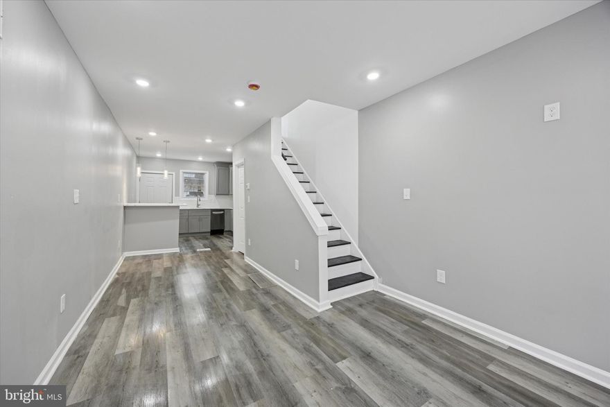 Welcome to this meticulously renovated townhome located in the heart of Norris Square, Philadelphia.
This beautifully updated Airlite-style residence offers a harmonious blend of modern design and timeless comfort. Every room has been thoughtfully renovated to provide a contemporary living experience. Upon entry, you are greeted by abundant natural light streaming through the front-facing windows, enhanced by recessed lighting and elegant charcoal gray vinyl flooring that flows seamlessly throughout the main level. Neutral-toned walls contribute to a bright and inviting atmosphere. The home is equipped with central air conditioning and forced-air heating, ensuring comfort in all seasons. The modern kitchen features brand-new stainless steel appliances, including a built-in microwave, dishwasher, and a double-door refrigerator with an ice maker. From the kitchen, step out into the private, patio-style backyard—ideal for outdoor relaxation and entertaining. The lower level includes washer and dryer hookups and offers ample space for storage. The second floor hosts two bedrooms and a fully renovated bathroom. Conveniently located, this home is just steps away from public transportation, offering easy access to all that Philadelphia has to offer. This property is in a location eligible for numerous First Time Homebuyer Grants starting from $10,000 and up! Don’t miss this exceptional opportunity to own a turnkey property in the vibrant and growing Norris Square neighborhood.