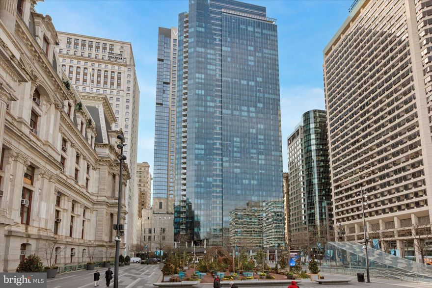 Named "Ritz Carlton's Residential Property of the Year, live the Ritz-Carlton Ultra-Luxury Lifestyle in Center City Philadelphia!   Lock in your new home at 'The  Residences at the Ritz' as the city prepares to celebrate the Nation's 250th birthday!  Philadelphia will be hosting THE exciting events of 2026: the FIFA World Cup, NCAA March Madness, the MLB All-Star Game, the PGA Championship, along with historical events surrounding America250.  Enjoy the world-renowned hospitality and unmatched service of Ritz-Carlton, including 24-Hour Concierge & Doorman, Access to the Residents' Mercedes EQS House Car, Valet Parking, and Luxurious Amenities.  Residents enjoy exclusive access to the 2nd Floor Amenities Area featuring:  State of the Art Gym, Yoga/Pilates Room, 60' Indoor Lap Pool & Hot Tub. Also on the Residents Amenities Floor is a stylish Residents Lounge & Separate Media Room, Outdoor Terrace and large Dog-Run. A Private Residents Park has a waterfall feature and offers you a well-deserved moment of Zen.  This unit features 10' ceilings, with breath-taking floor-to-ceiling windows with Hunter Douglas shades that offer a view of the lush greenery on the W Hotel terrace.  Enjoy an open kitchen design with a huge granite countertop offering extra seating/prep space, a built-in Subzero refrigerator and Miehle dishwasher, Viking gas range, and wine cooler. The beautiful granite countertop extends up to create a seamless modern backsplash. You'll notice the updated Brazilian cherry hardwood flooring throughout, and the space-saving stackable washer/dryer (full size!) in a quiet separate laundry closet.  The primary bedroom suite has plenty of room for your furniture, and a gorgeous master bathroom.  The marble bathroom includes double sinks, large shower with rainfall shower head, and a Duravit soaking tub. The second bedroom also has an adjacent bathroom with modern finishes & fixtures. This home offers the ultimate in convenience and luxury, nestled amongst the rich history and modern lifestyle of Philadelphia!