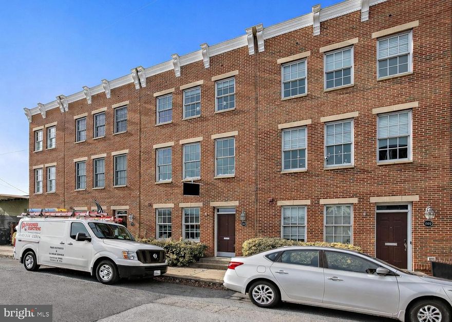 Welcome to 1324 Haubert Street. A four-story townhome set in the heart of Locust Point, where city energy meets waterfront living. Light pours in from every level. Storage stays abundant. Garage parking keeps life simple. A rooftop deck seals the deal.

The entry level sets the tone. The first of three bedrooms sits on the first floor, finished with custom paint and a built-in Murphy bed. It works as a guest suite, home office, or flex space without compromise. Fresh paint and hardwood floors run throughout. A full bath and utility room add everyday function, with a newly updated HVAC system, water heater, and hardware giving peace of mind. Direct access to the enclosed two-car garage delivers rare city convenience, plus extra storage and a second refrigerator. 

Up one level, the home opens wide. The living room feels bright and expansive, anchored by high ceilings and hardwood floors. Custom built-ins and an entertainment center elevate the room while keeping it practical. Dual French doors flood the space with natural light and lead to a private outdoor deck. Brand New Composite materials and weatherproof details make for a maintenance-free, long-lasting, outdoor retreat - Perfect for morning coffee, evening wine, or hosting friends.

The kitchen commands attention. An oversized island invites gathering. Sparkling new quartz crystal countertops, custom built-in cabinetry, and a JennAir gas range deliver a true chef’s setup. Stainless steel appliances complete the look.

The dining area flows seamlessly, making everyday living easy and entertaining effortless. Newly updated lighting and hardware throughout elevate these spaces with timeless and modern appeal, making everything shimmer and shine. 

The third floor offers privacy and comfort. The primary suite feels like a retreat, with his and hers closets and a spa-inspired bath featuring dual vanities, a soaking tub, and a walk-in shower. French doors bring in natural light and open to a private balcony made with the same brand new long-lasting materials guarantee many peaceful city views. A second bedroom on this level features hardwood floors, a large walk-in closet, and oversized windows for an open, airy feel. The top floor brings the lifestyle home. 

A loft with an updated wet bar opens to an expansive rooftop deck. City skyline. Water views. Sunset evenings. This space turns ordinary nights into something special and makes entertaining unforgettable. 

Locust Point ties it all together. Walkable streets. Waterfront paths. Easy access to the free water taxi to Fells Point. Close to downtown, I-95, and major transit. You stay connected without giving up neighborhood charm. 1324 Haubert Street delivers light, space, storage, and views. Homes like this do not come around often. Come see it. Picture your life here.