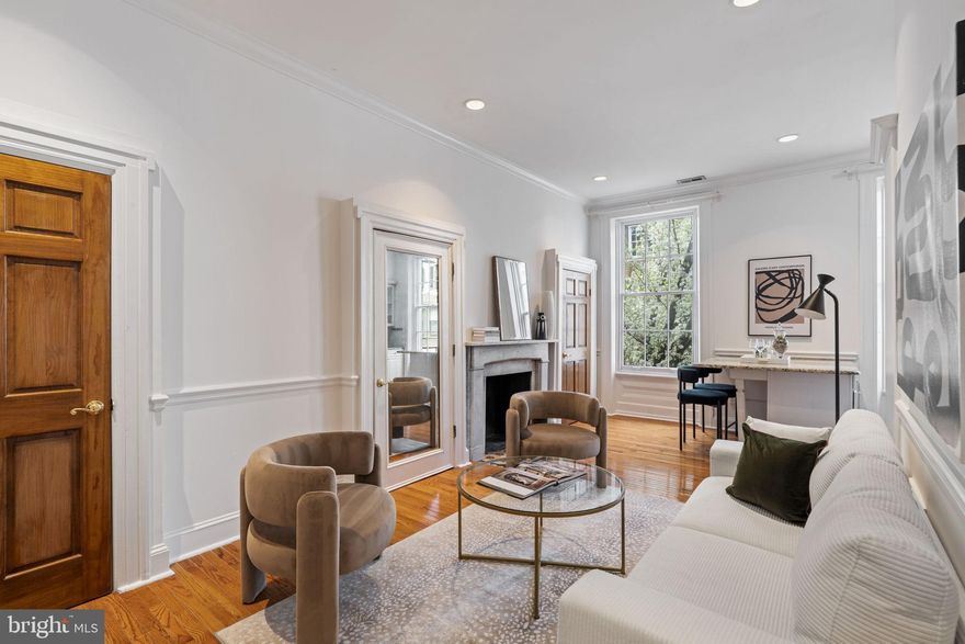 Nestled in the heart of Rittenhouse Square, this beautifully designed one-bedroom, one-bathroom condo is situated in a boutique seven-unit building on a tree-lined street. This second-floor walk-up residence boasts soaring ceilings and abundant natural light, creating a bright and airy atmosphere. The open-concept living and dining area showcases hardwood flooring, crown moldings, oversized windows, and a fireplace, offering both elegance and warmth. The thoughtfully designed kitchen is a chef’s dream, featuring stainless steel appliances, granite countertops, a beverage fridge, and a custom island with breathtaking city and treetop views. The serene bedroom provides a peaceful retreat, complete with a decorative fireplace mantle and a generously sized closet for ample storage. Just off the bedroom, a dedicated laundry closet houses a Bosch washer and dryer for added convenience. The bathroom blends classic charm with modern functionality, featuring a single-sink vanity, a tub/shower combo, and built-in cabinetry for extra storage. Located just two blocks from Rittenhouse Square Park, 1730 Pine Street offers the best of city living, surrounded by premier shopping, dining, and everyday conveniences. Don’t miss this opportunity to own a stylish and sophisticated home in one of Philadelphia’s most sought-after neighborhoods!