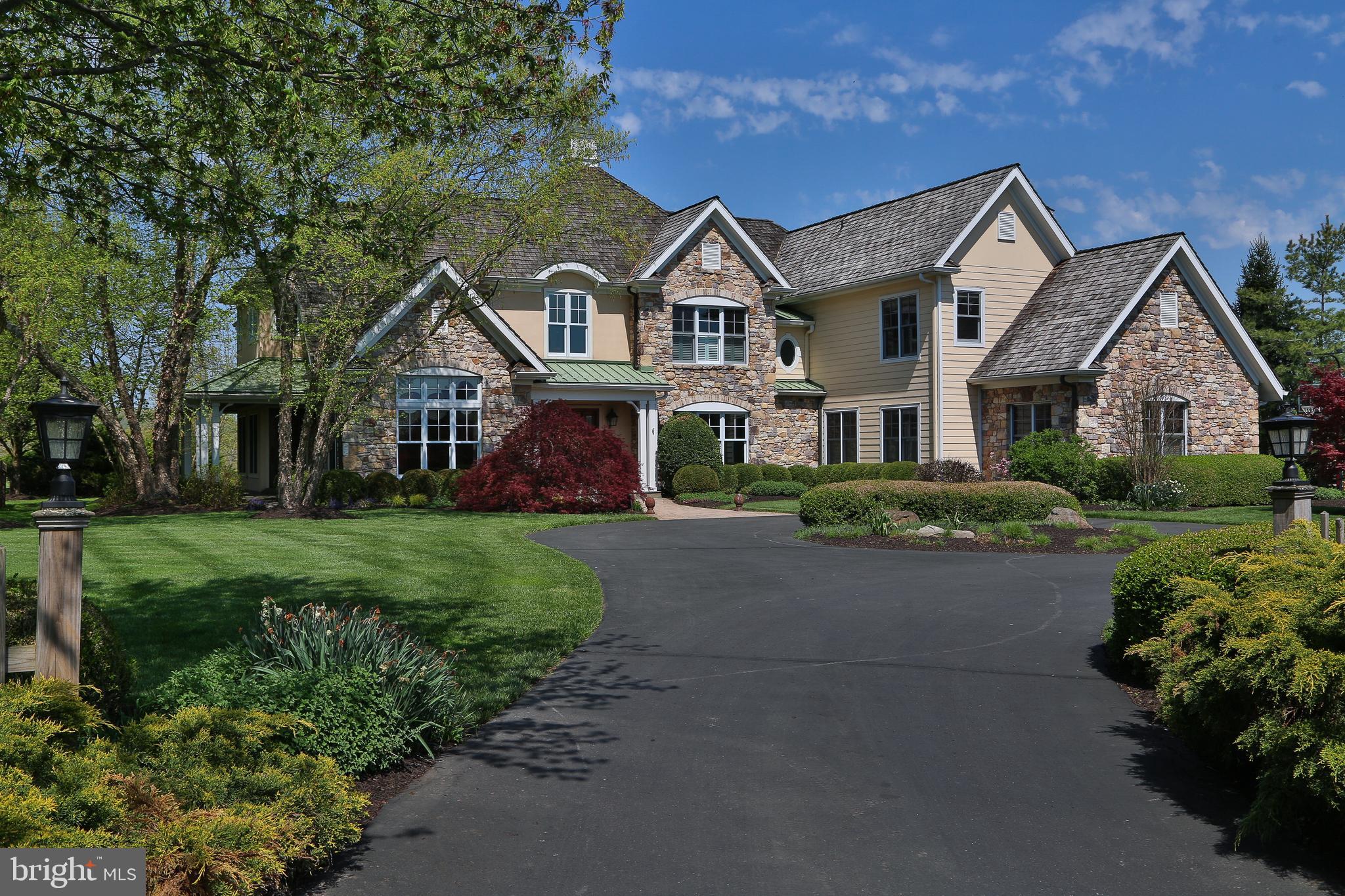 Your next home has arrived! A glorious setting on a wonderful cul de sac w long distance views. It's a Stone, Hardi Plank and Stucco beauty that sits attractively off the road against what many believe to be Bucks County's finest Golf Club, Lookaway. This gorgeous 2 acre Lot has a strategically positioned septic system and well; both away from the center of the yard. Plenty of area to add features or pool. It also has a stunning Landscape package that embraces all four sides. It's a combination of privacy and long neighborhood not often found. You look across not only Lookaway Golf Club's 4th fairway, but with a mountain view as well. The exterior also has a sweeping circular drive that allows for guest parking before getting to the oversized pad near the three car garage. Each side elevation has lovely covered patios w slate flooring. The rear has a covered patio w slate and brick flooring, w cooking package, large stone wall w FP and angled wood finished ceiling. There is also a trex deck w vinyl rail.
The interior has simply too many features to mention. The second floor hallway is a balcony accessed by two staircases. Overlooks to the foyer and Great Room. The Owner Suite has a 350 sf sleeping area w high ceiling, two 60 sf fitted out WICs and a 125 sf bath w split sinks, jetted tub, shower and LC. BRS 2 & 3 share a hall bath and BR 4 has it's own bath en suite. BR 4 also has 3 closets and a high ceiling up to dormer windows. The first floor has BR 5 w a 92 sf WIC or retreat and it's own full bath. Great for family or guests as it is located in the rear left of the main level. The kitchen, breakfast room and Great room all have windows to the rear. The 2 story GR has a stone faced propane gas FP. Kitchen: Tile floor, granite, island w high bar level, Wolf gas range w GE hood, Bosch DW, Sub Zero Refrig, Breakfast area w high ceiling, Butler's pantry in hall w Beverage refrig, sink, glass front cabinets. The 246 sf Den has an exterior door to access the covered porch w columns, metal roof, wood ceiling and slate slab. High ceilings are complimented by stained beams, cherry paneling and floors. The TV in the den stays. LR, DR, Laundry and foyer w turned stair are all in the forward half. Combo of 2 1/4" oak and carpet throughout. Tile in kitchen and baths. Some Transom windows. Some Multipiece crown. The service hallway connecting the laundry/mud (w sink) and garage to the kitchen has a service door to the covered patio on the right side of the home w the same ceiling, column and slate finishing seen on the left. The awesome basement level provides storage and a spot for mechanical systems but is nearly entirely finished. There is a media room w full stone wall & gas FP, there is a billiard room and a bar area w a long run of cabinets, appliances, sink, DW, keg hook up, bar refrig and granite top that separates the two. There are two rooms to use as you like (exercise and office), there is a full bath w sauna and steam shower w frameless door. Finally, for those that enjoy a fine wine .... a lovely climate controlled "wine cellar" w first class finishes of etched glass door, tile floor, stone walls and shelving. There is a walk up exit to the rear yard. Concrete basement walls, 400 Amp Service. EV Charger, Generator that powers 35% of home, water treatment system and an unplugged underground dog fence that they have not used. Three HVAC systems, one for each floor. Foyer light lift for bulb replacement and cleaning. Plantation shutters on the bottom half of various windows. Three car garage has two doors, each one is stained. Front Door is stained.
Driveway cracks resealed , curb area repaired and then entire driveway sealed summer of 2022.
Please visit to see if you can make 1703 Lookaway Court your home for the next dozen years. Or more!
There is a small Golf Course irrigation easement at rear prop line.