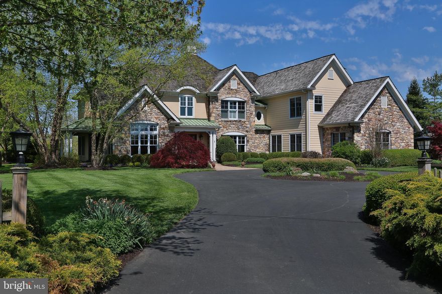 Your next home has arrived!  A glorious setting on a wonderful cul de sac w long distance views. It's a Stone, Hardi Plank and Stucco beauty that sits attractively off the road against what  many believe to be Bucks County's finest Golf Club, Lookaway. This gorgeous 2 acre Lot has a strategically  positioned septic system and well;  both away from the center of the yard. Plenty of area to add features or pool. It also has a stunning Landscape package that embraces all four sides. It's a combination of privacy and long neighborhood not often found.  You look across not only Lookaway Golf Club's 4th fairway, but with a mountain view as well. The exterior also has a sweeping circular drive that allows for guest parking before getting to the oversized pad near the three car garage. Each side elevation has lovely covered patios w slate flooring. The rear has a covered patio w slate and brick flooring, w cooking package, large stone wall w FP and angled wood finished ceiling. There is also a trex deck w vinyl rail.

The interior has simply too many features to mention.  The second floor hallway is a balcony accessed by two staircases. Overlooks to the foyer and Great Room.  The Owner Suite has a 350 sf sleeping area w high ceiling, two 60 sf fitted out WICs and a 125 sf bath w split sinks, jetted tub, shower and LC.  BRS 2 & 3 share a hall bath and BR 4 has it's own bath en suite. BR 4 also has 3 closets and a high ceiling up to dormer windows. The first floor has BR 5 w a 92 sf WIC or retreat and it's own full bath. Great for family or guests as it is located in the rear left of the main level. The kitchen, breakfast room and Great room all have windows to the rear. The 2 story GR has a stone faced propane gas FP. Kitchen: Tile floor, granite, island w high bar level, Wolf gas range w GE hood, Bosch DW, Sub Zero Refrig, Breakfast area w high ceiling, Butler's pantry in hall w Beverage refrig, sink, glass front cabinets. The 246 sf Den has an exterior door to access the covered porch w columns, metal roof, wood ceiling and slate slab. High ceilings are complimented by stained beams, cherry paneling and floors. The TV in the den stays.  LR, DR, Laundry  and foyer w turned stair are all in the forward half. Combo of 2 1/4" oak and carpet throughout. Tile in kitchen and baths. Some Transom windows. Some Multipiece crown. The service hallway connecting the laundry/mud (w sink) and garage to the kitchen has a service door to the covered patio on the right side of the home w the same ceiling, column and slate finishing seen on the left. The awesome basement level provides storage and a spot for mechanical systems but is nearly entirely finished.  There is a media room w full stone wall & gas FP, there is a billiard room and a bar area w a long run of cabinets, appliances, sink, DW, keg hook up, bar refrig and granite top that separates the two. There are two rooms to use as you like (exercise and office), there is a full bath w sauna and steam shower w frameless door.  Finally, for those that enjoy a fine wine .... a lovely climate controlled "wine cellar" w first class finishes of etched glass door, tile floor, stone walls and shelving. There is a walk up exit to the rear yard. Concrete basement walls, 400 Amp Service. EV Charger, Generator that powers 35% of home, water treatment system and an unplugged underground dog fence that they have not used. Three HVAC systems, one for each floor. Foyer light lift for bulb replacement and cleaning. Plantation shutters on the bottom half of various windows. Three car garage has two doors, each one is stained. Front Door is stained.
Driveway cracks resealed , curb area repaired and then entire driveway sealed summer of 2022.

Please visit to see if you can make 1703 Lookaway Court your home for the next dozen years. Or more!
There is a small Golf Course irrigation easement at rear prop line.