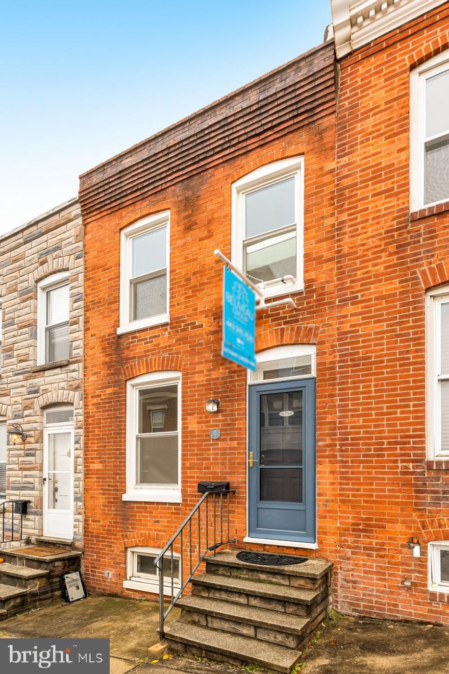 Welcome to the Riverside neighborhood in Baltimore! Enter into this brick-front beauty featuring hardwood floors throughout the main level. Continue your tour through the living room past a cozy dining nook, convenient half bathroom, and stacked laundry. The updated kitchen is in the back of the home with stainless steel appliances, a tile backsplash, and a gas range. The back door heads out to a spiral staircase taking you to the rooftop deck - you'll want to save this slice of paradise for last! Upstairs are two fully carpeted bedrooms and an updated full bathroom with a shower and tub. The second bedroom and the bathroom both have skylights providing ample natural light! Finally, head up the spiral staircase to the rooftop trex deck with sweeping views of Baltimore and the water! Once the spring rolls around this will be the prime spot for entertaining with friends or family. The location is a stones throw from the amenities of Federal Hill and Locust Point, all while just around the corner from the water. Start 2023 off with the keys to your new Baltimore home!