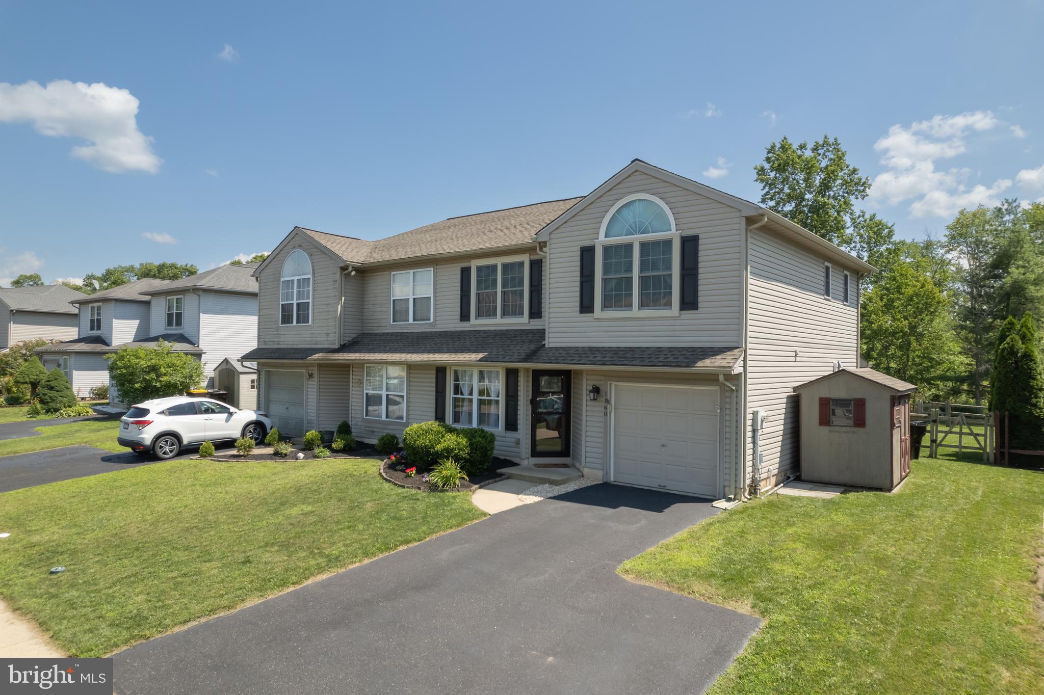 Welcome to your new home! This updated 3 bedroom, 1.5 bathroom twin in the desirable Walnut Bank Farms Neighborhood features a 1-car garage and fenced-in backyard. Situated in a peaceful neighborhood, but minutes away from Route 309 and downtown Quakertown, you couldn’t ask for a better location! For worry-free ownership, many major improvements have been made within the past six years - new windows (2021), new appliances (2021), new roof (2020), new HVAC (2019), and Pergo flooring on main level. Step inside to find a spacious living room leading into the dining area with crown molding – a great set-up for entertaining! The eat-in kitchen highlights updated appliances, tile backsplash, granite countertops, recessed lighting, and tons of natural light. The main level also includes a powder room, coat closet, and a storage area under the steps. Upstairs you will find a large primary bedroom with vaulted ceilings and a large walk-in closet. Just outside of the primary bedroom, the hall bathroom features tile floor, a large granite countertop vanity, shower/tub and a linen closet. Across the hall, you'll find two nicely-sized bedrooms with closet space, offering versatility for family or home-office space. The second floor also offers the convenience of a laundry area and pull-down steps leading to the floored attic space for extra storage needs. Outside, the home features a back patio and a large fenced-in backyard that backs up to a wooded area for privacy and peace & quiet. A 1/2 mile walking trail behind the home leads you to downtown Quakertown – right to Memorial Park, Community Pool, Public Library and a variety of shops and restaurants. You can enjoy all of the benefits of this wonderful neighborhood with no HOA fees! Don’t miss out on this beautiful home in an ideal location! Showings begin at Noon Friday August 1st - there will be 2 Open houses Saturday from 1-4pm and Sunday from 12-4pm.