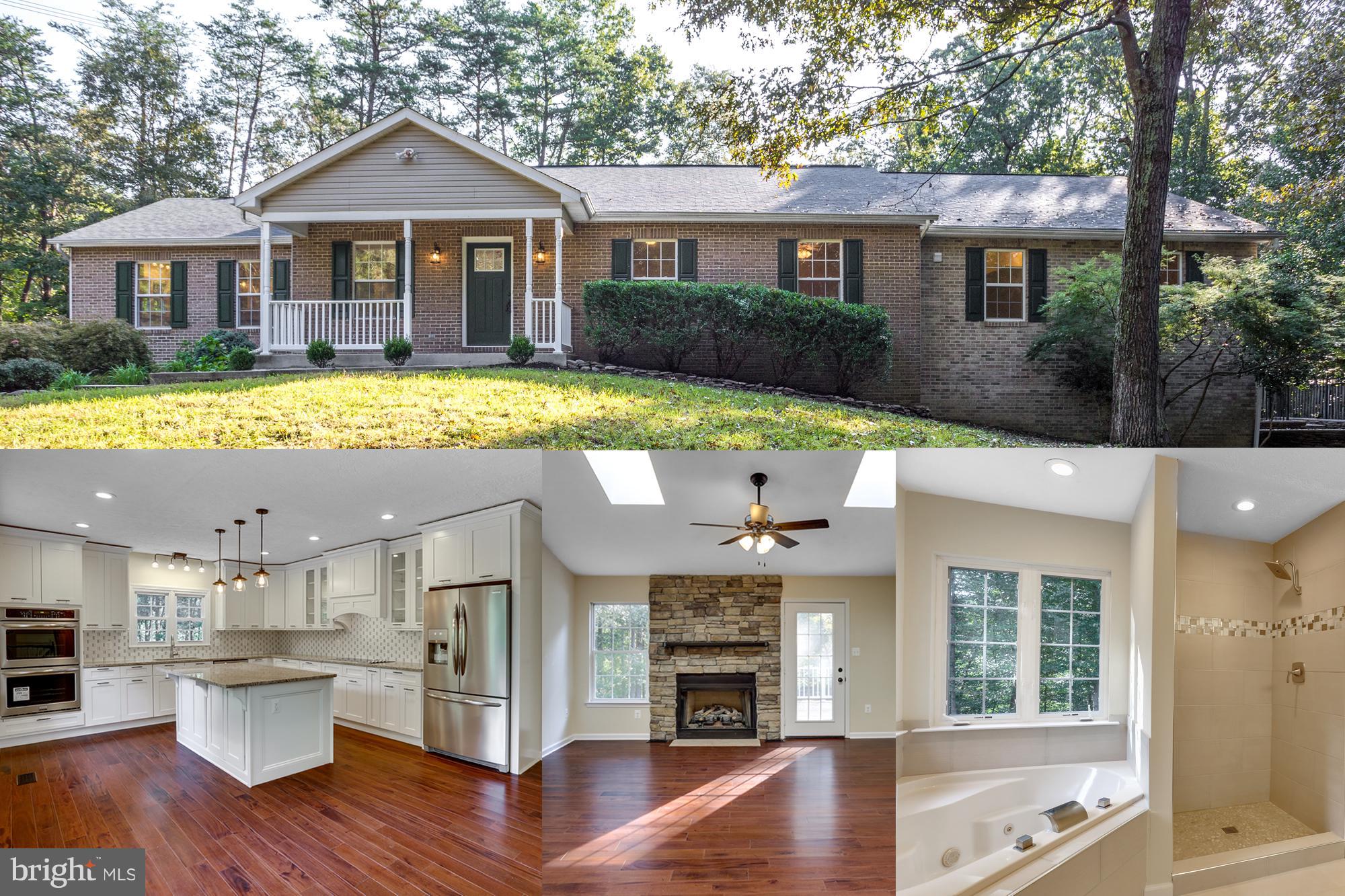 Welcome to your private oasis! Absolutely stunning home with over 4,000 sq ft totally renovated on 4 acres. Features gourmet kitchen w/granite, double oven, upgraded cabinets, hardwood floors, 2 master BRs, 2 laundry rooms, finished basement w/full bar & fireplace. Basement has in-law suite or rental potential. Relax on the deck & patio or entertain in the cabana. Extended & circular driveway. No HOA!