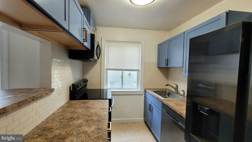 Back to Active - Don't Miss Out! - This stylish two-bedroom, one-bathroom condo in Washington, D.C. offers modern comfort and urban convenience. The open-concept living space features abundant natural light, creating a warm and inviting atmosphere. The kitchen is equipped with updated stainless steel appliances, subway style backsplash, perfect for cooking and entertaining. In-unit laundry adds an extra layer of convenience, while the thoughtfully designed layout provides both functionality and comfort. Situated in a vibrant D.C. neighborhood, this condo offers easy access to local restaurants, shops, and public transportation—making it an ideal home for city living.