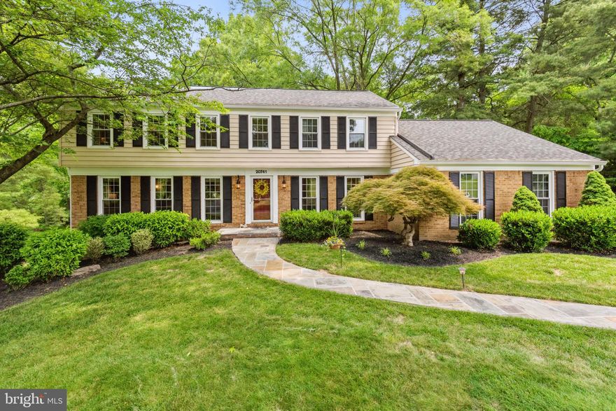 Extraordinary curb appeal welcomes you to this pristine center hall colonial perfectly situated on a majestic park-like 1.72 -acre lot. Hardwood floors throughout the main and upper levels. Elegant formal living and dining rooms with crown molding grant an enviable amount of space to host guests with ease. A sunny family room with recessed lighting and a wood-burning fireplace is perfect for everyday living. Perfectly situated off of this room is an impressive low-maintenance composite deck that creates an amazing outdoor living space with great party flow or simply a quiet spot to enjoy morning coffee. The gourmet eat-in kitchen features a breakfast bar with room for seating, table space overlooking the beautiful backyard, and a built-in desk.  This sun-drenched modern kitchen also boasts recessed lighting, granite counters, soft-close cabinetry, and GE Profile stainless steel appliance. Situated off of the kitchen is a large mudroom and laundry room with access to the two-car garage. Upstairs retreat to your sun-filled primary suite with a walk-in closet and private bathroom with a soaking tub overlooking the serene backyard. Three additional bedrooms and a renovated hall bath complete the second level. Daylight-finished lower level is perfectly designed for entertaining! Large recreation room with recessed lighting and built-ins has room to relax and entertain and a separate space ideal for a home gym or gaming area.  From this level, access the slate patio perfect for evening parties. Gather around the built-in firepit on chilly evenings. A gorgeous fully fenced backyard is your own slice of heaven.  Other notables on this special home include new GE Profile stainless steel appliances: microwave and fridge (2023), stove (2022), water softener/water filtration system with UV light (2021), siding and gutters (2021), roof (2019), and water heater (2019). Only one mile to grocery stores, pharmacies, dry cleaners, and more! Close to quaint Laytonsville with nurseries, golf courses, post office, and restaurants. Less than an hour to BWI, Dulles, and National airports. Commute with relative ease to DC, Baltimore, Bethesda, or Frederick.