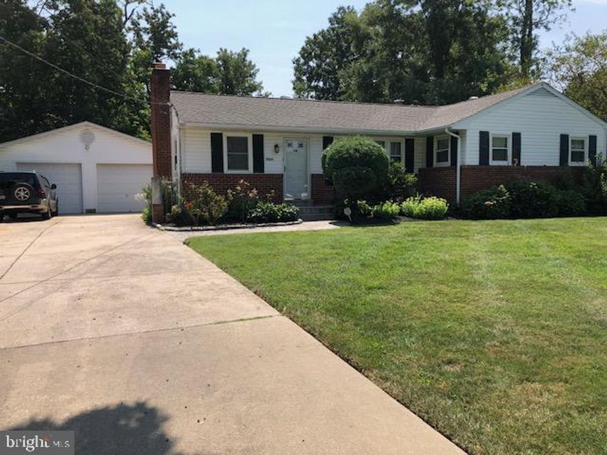 Welcome to this beautiful home with large country kitchen addition (approx. 22x15) large garage (approx. 24x30) with 2 doors and door openers, 3 bedrooms and 1 and half updated baths on main level, Kit and baths all with nice ceramic tile, beautiful hardwood floors, (no carpet) wood burning stove insert on the original brick fireplace. Downstairs there are 2 extra rooms one with window, great for exercise room, office or den, along with full bath with shower, laundry room, nice ceramic tile on rec room floor and bath, no carpet, storge areas and walk up stairs to outside. Outside features a large flat  and fenced lot, gate that closes, a large Gazebo,  fish pond, stamped concrete patio, brick BBQ, lots of flowers and fig tree. A real must see home in a great location.