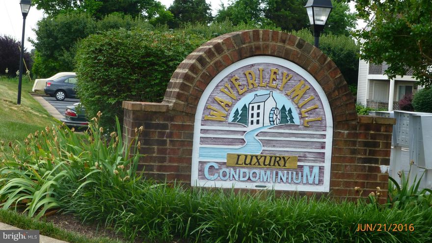 **1st Floor-No Steps!!***  Lovely main level unit freshly painted, new carpet, new refrigerator, new flooring in kitchen & foyer.  Great private patio with storage room & view of manicured lawn & trees. Can't beat the location just across from all the shopping, theaters, restaurants you can think of, but located in a quiet well-kept small community.    Last model like this sold in 1 day.