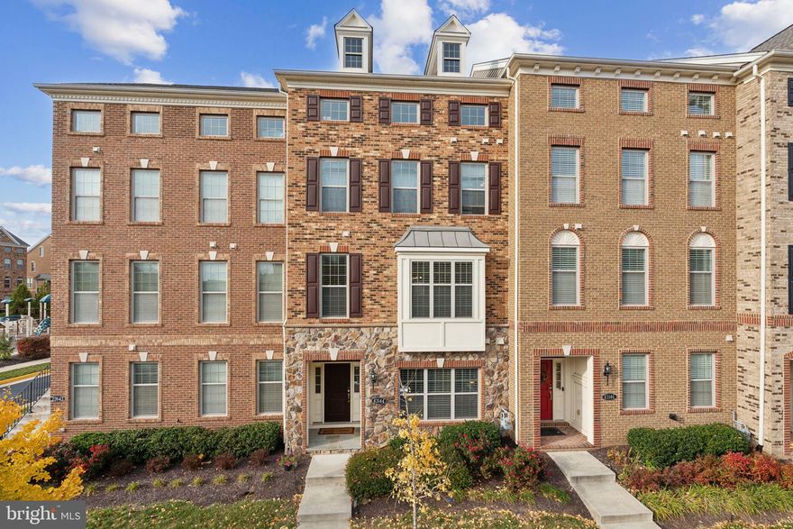 Stunning 4 Level Townhouse for sale in sought after Moorefield Station - Built in 2017 - This beautifully maintained Bethesda model with Loft & Rooftop deck has 4 bedrooms and 4.5 bathrooms and offers modern living with almost 3,000 square feet of living space.  Entry level bedroom with ensuite full bathroom.  The main floor offers a bright and airy, open floor plan perfect for entertaining. The living room flows seamlessly into the dining area and kitchen, creating a welcoming space for everyday living. The kitchen is equipped with stainless steel appliances, granite countertops, a large island, and plenty of cabinet space, making it a chef’s dream. Enjoy outdoor living with a private deck off the main level. Upstairs features the huge primary bedroom suite with oversized walk-in closet and primary luxury bathroom with dual sinks, standing shower and separate soaking tub, 2 additional spacious bedrooms with their own shared bathroom and washer/dryer. The 4th level loft features vaulted ceilings with skylight and its own full bathroom plus outdoor Rooftop deck that overlooks the courtyard. Prime lot conveniently located across from the Clubhouse pool, tot/lot playground and ample visitor parking. Close to Moorefield Station Community Park with baseball & softball diamonds, a soccer field, covered picnic areas & playground. Highly sought-after Loudoun County schools and within minutes of restaurants, shops, and entertainment. Brambleton Town Center is less than 2 miles away and is a fabulous place with your local Harris Teeter, movie theaters, walking paths, and shopping. Enjoy the ease of being situated between Loudoun County Parkway and Claiborne Parkway, close to major commuter routes and the brand-new Ashburn Silver Line Metro station. The community features a swimming pool and other amenities such as tot lots, exercise facility, clubhouse and open space. The HOA provides trash removal, snow removal, mowing, mulching, pruning and edging of your yard, access to the clubhouse plus events throughout the year. Ten acres of open space including 4 neighborhood parks with walking trails await you to explore.