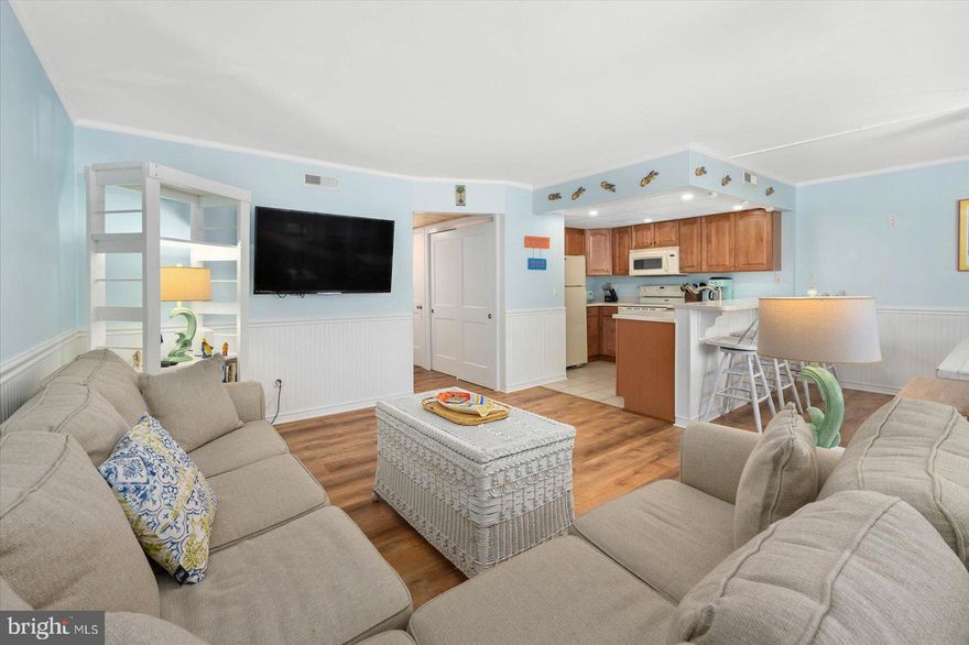 Exceptional Properties. Exceptional Clients. Beautiful 2 bedroom and 2 bathroom FIRST FLOOR - OCEAN BLOCK condo, steps to the beach! NEW flooring, chic wood plank ceiling in hallway, newly remodeled bathroom with walk in shower, New Hot water heater and freshly painted throughout! Primary bedroom features a private bathroom.  Unit comes fully furnished displaying a modern chic beach vibe. Enjoy your morning coffee and family gatherings on your own large balcony which includes closet space for your beach gear needs. Unit comes with  2 private parking spaces located in the back of the building. Free public parking spots are in the front. Reserve study has been completed and CABLE is included in the low condo fee. The unit can be used for personal leisure and make an excellent RENTAL. Walk to all of the Restaurants, Grocery Stores, Miniature Golf & Nightlife activities. Enjoy permitted family bonfires on the beach. You’re directly across from OC’s famous North Side Park! Playground, Outdoor Ball Park, Indoor Basketball Court & a long Walking Pier for crabbing. Every weekend in August there’s Sunday's In The Park W/Fireworks, Free Outdoor Concerts & the town’s large display of Fireworks Over 4th Of July! Easy to show! THIS ONE WILL GO FAST!