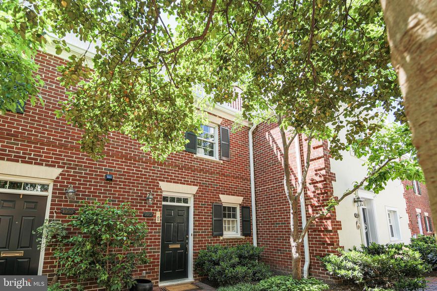 Welcome home to the Watergate of Alexandria community in North Old Town. This three-level brick townhome featuring nearly 1600 square feet of living space is nestled in a picturesque and serene brick-lined courtyard complete with lush landscaping and graceful architectural details. This beautiful 2 bedroom, 2 ½ bathroom home features wide plank wood floors and recessed lighting throughout.

The first floor features a large galley kitchen with granite counters, stainless steel appliances, spacious pantry storage, and room to sit and sip your morning coffee. The home’s dining room is just beyond, a room spacious enough to host large gatherings or intimate dinner parties. With its views of the courtyard and idyllic fountain and pond, it’s a scenic space you won’t want to leave. The first floor also features a sizeable coat closet, a dedicated laundry closet, and a discreetly located powder room complete with a glass chandelier, Venetian-inspired mirror, pedestal sink, and beadboard wainscotting.

The second floor of the home features an expansive living space with a wood-burning fireplace, large windows, built-in shelving and storage, beautiful moldings, and a built-in bar. One of the home’s two bedrooms is located on this level as well as one of the home’s full bathrooms complete with a walk-in shower and marble tile. 

The top level of the home features the owners’ suite. This retreat is complete with spacious closets, a large renovated full bath with marble-tiled floors and walls and a Carrara-marble topped vanity, as well as an expansive veranda with sweeping views of the surrounding area. Pull-down stairs provide easy access to the attic from this level, where additional storage awaits. 

This home conveniently comes with gated underground parking and 1 assigned space, a rare find in Old Town. It’s a short distance to King Street’s shopping and dining as well as the newly established shops and restaurants of North Old Town, dog parks, the renowned Old Town farmers market, and the waterfront. Its central location is also convenient to Braddock Road Metro, Ronald Reagan National Airport, Amazon HQ2, Trader Joe's, Harris Teeter, the Charles Houston Rec Center, Queen Street Library, and much more.

The Watergate of Alexandria is an award-winning residential community of 100 elegant Williamsburg-style row homes and beautifully landscaped courtyards and gardens. The monthly fee includes exterior building maintenance (including the roof, replaced in May 2022), common area maintenance, reserved underground parking, master insurance, snow removal, trash removal, water, and sewer. A new owner capital contribution fee equal to 1/2 of 1 percent of the contract price is assessed at settlement.