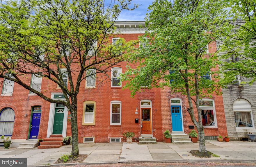 This home on the coveted Butchers Hill block that backs to the beautiful gardens of Halcott Square has it all- space (2,000+ square feet), great layout-3 large bedrooms, 2 and a half updated full baths, a large gourmet eat-in kitchen with sliders to a private garden, AND 2 car parking! Great original details including hardwood floors throughout, crown molding, and a claw foot tub (plus a separate shower). Great light and tons of windows. Bonus space on the first floor. Large basement that is great for storage. Door already installed off the third floor provides easy access to the roof if you want to add a deck! One block to Patterson Park and an easy walk to Hopkins, Fells Point, Canton, and the Harbor. Easy parking off of a real street (not a small alley).  Hopkins Shuttle and bus lines are right around the corner.  Around the corner from Charmed Kitchen and La Barrita, 2 great neighborhood spots! Come see this beautiful home!