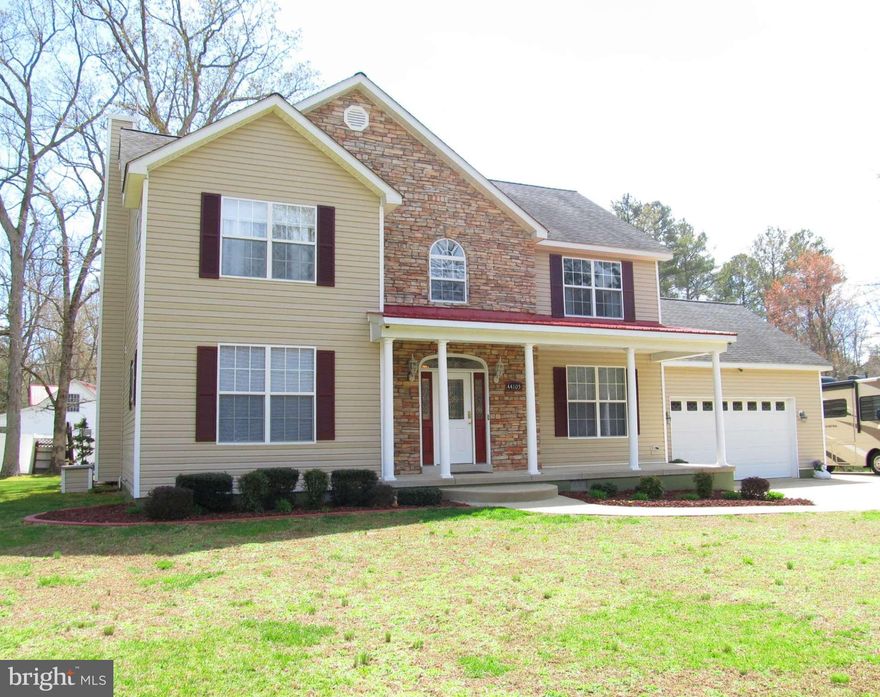 Custom built home. Minutes from PAXNAS. Quiet, private location. Main level features open floor plan*9 ft ceilings*some hdwd floors*hypoallergenic carpet*arch doorways*gas fp. Lg master bedroom w/ sitting rm*tray ceiling*jetted tub*sep shower. Relax on the deep front porch or the covered rear porch. Oversized 2-car garage /reinforced, dbl RV parking pad. Storm cellar & attic for extra storage.