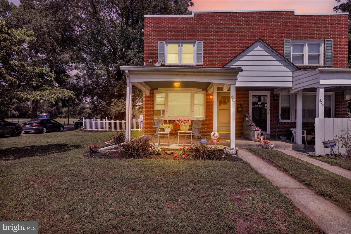 Welcome to 801 Delta Ave, a charming brick semi-detached home gracefully situated on a fantastic corner lot in the quaint community of Northmont. Step inside and discover an inviting atmosphere where a calming palette of soft blue walls beautifully complements rich, character-filled hardwood floors. Sunlight streams through expansive windows, bathing the spacious living room in warmth and light. A charming staircase with classic white railings adds architectural interest. An elegant arched doorway provides a seamless transition to the heart of the home: a kitchen that masterfully blends rustic warmth with modern convenience. Natural wood cabinets and wainscoting evoke a cozy, country feel, while gleaming stainless steel appliances provide a sleek, contemporary touch. A large center island offers ample prep space and casual seating, perfect for morning coffee or informal meals. The allure continues in the finished basement, an entertainer's dream featuring a cozy gas fireplace, a convenient half bath, and a stylish wet bar—ideal for hosting friends and family. Upstairs, the beauty of hardwood floors flows seamlessly throughout the second level, enhancing the sense of warmth and continuity. The primary bedroom is a spacious retreat, complete with a refreshing ceiling fan and a generous closet. The lovely full bath boasts a brand new faucet, adding a touch of modern elegance. A versatile second bedroom offers endless possibilities to suit your family's needs, boasting an impressively spacious closet. For those who cherish the outdoors, this home offers delightful options. Enjoy cool summer evenings on your cute front porch, or retreat to the serene backyard, a private oasis surrounded by maintenance-free fencing, perfect for admiring nature. Don't miss the opportunity to experience this exceptional home. Call today for your private tour!