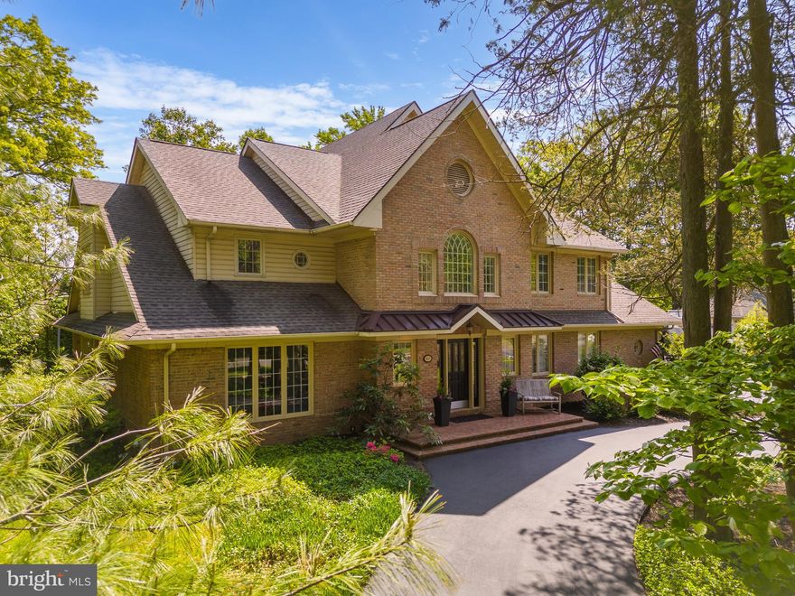 Welcome to 825 Foxwood Circle - This stately custom-built brick home is situated on a quiet cul de sac in a very desirable Whitemarsh location close to WVCC and the Wissahickon trail.  This 4 BR/2 full plus 2 half bath features a floor plan which is perfect for today's modern living.
Enter the grand foyer replete with dramatic and elegant 2-story ceiling with custom moldings and millwork and new onsite finished oak hardwood floors.  A formal powder room is off to the right, ideal for guests plus a convenient coat and storage closets.  A private step-down large office with large windows facing the front and grass wallpaper is ideal for today's work from home lifestyle.
In the rear is the fabulous open concept living area.  A true chefs eat-in kitchen completed in 2018 features Thermador and Bosch appliances, white shaker cabinetry, custom hood, contemporary quartz countertops and island complete with bar sink and ice maker.  Informal den area with bar area is perfect for casual daily living or entertaining. 
Center dining room area featuring a dramatic atrium style vaulted ceiling with skylights and custom built-in leads down to a gorgeous sunken living room in the rear with a gas fireplace and walls of glass overlooking the patio and pergola with white Japanese wisteria.  The rear yard is private and tranquil and easy to maintain.  The deck is waiting for your entertainment, grilling and outdoor gatherings.
Ascend to the elegant second floor to a central mezzanine open to the vaulted ceiling and overlooking the living floor.  4 great-size bedrooms and 2 full baths have been thoughtfully designed around the mezzanine.  Primary suite oasis complete with spacious BR includes custom plantation shutters.  Large en-suite complete with oversized jetted soaking tub, step-in shower, vanity and dressing area plus walk-in closet with custom built-ins.  A convenient additional office space with a deck overlooking the tranquil rear yard.
The 3 great sized guest BR's all with custom closets, 1 guest BA plus great additional storage closets complete this floor. 
The finished lower level is incredible additional living space including a media room with video and sound equipment plus a large game room.  Unfinished basement rooms provide endless storage and a workbench for the DIY-er.  Oversized 2-car garage with epoxy floor plus a convenient mud room with custom built-in cubby/cabinets/bench.  Large laundry room with side-by-side washer/dryer and lots of storage plus an informal powder room.
A gorgeous home with incredible curb appeal, true quality craftsmanship in prime Lafayette Hill location just over the Chestnut Hill border with Whitemarsh Township low taxes and Blue-Ribbon Colonial School District.  Easy access to Center City and major highways.  A truly exceptional home for today's modern living.