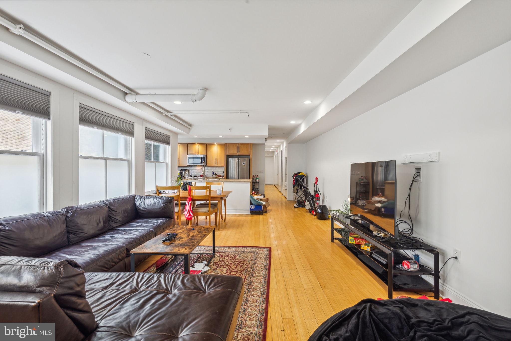 One-of-a-kind duplex loft residence located on the top two floors of 1606 Chestnut Street, a boutique elevator building in the heart of Center City. This duplex loft is over 2,000 square feet and offers the perfect legal living/workspace environment, as there are two separate entrances into the home. The top floor of this spacious 3 bedroom, 2.5 bathroom home (5th floor) offers high 10' ceilings and freshly renovated floors. There is a large great room with ample space for living and dining and a wall of oversized windows offering excellent natural light. The open kitchen features concrete countertops, sleek wood cabinetry, a breakfast bar and stainless-steel appliances, including: French door refrigerator, 4 burner gas cook-top, dishwasher, wine fridge, electric wall oven, and microwave. The spacious primary bedroom enjoys oversized windows, a large walk-in closet, and ensuite bathroom with an oversized wet room with glass enclosed shower and tub, modern double vanity, and chrome fixtures. The other two bedrooms are generously sized and feature wall closets, skylights, and access to an ensuite bathroom with modern double vanity and tub shower. Additional highlights include a side by side washer/dryer, spectacular custom-built hallway closets, and a private storage space located in the basement. The lower level of the duplex (4th floor) can be used as an office or a very spacious room/game room/playroom. The room has huge windows beaming with natural light that overlook Two Liberty Place as well as a wet bar and powder room. There is a video intercom security system, elevator, central air, and recessed lighting throughout. Conveniently located in the prime area of Center City, the home is surrounded by shopping, dining, and Philadelphia nightlife. It is also steps away from the Market and Broad Street office corridors (Liberty Place and Comcast), Avenue of the Arts and Rittenhouse Square.