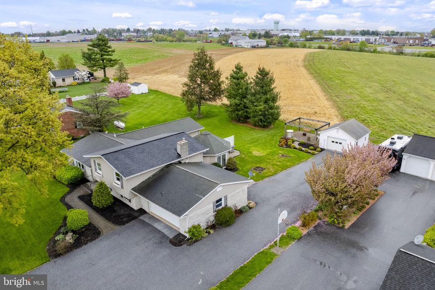 AUCTION DATE - TUESDAY, JUNE 9, 2026, AT 5 PM. LISTED PRICE IS AN OPENING BID ONLY AND IS NOT INDICATIVE OF THE FINAL SALE PRICE. REAL ESTATE: Custom spacious Holland stone/siding split level w/3704 SF eat-in kitchen w/custom cherry & painted cabinets w/granite & Corian tops, appliances & pantry, formal dining room, living room w/tray ceiling & bow window, octagon 4 seasons room w/cathedral ceiling, fireplace & slide door to L-shaped paver patio, laundry w/washer & dryer included, 5 bedrooms (primary bedroom suite w/cathedral ceiling & whirlpool tub & walk-in closet), 3½ baths. Lower-level w/2nd kitchen w/island & appliances, family room w/Holland stone fireplace & bonus/rec. room, propane forced air heat, central AC, attached 2-car garage, detached 1-car garage 18x20 & brick paver sidewalk all on level 2 ACRE country lot w/mature shade trees, professional landscaping, picnic area, farmland boundary, macadam driveway & parking, on-site well & public sewer. NOTE: Ideal Southern New Holland location, easy access to everything. Clean, well-maintained & move-in condition split-level house w/many upgrades, low maintenance & spacious. Terms 10% down, balance 45 days or before. Personal inspection by appointment or open house Sat., May 23, 30 & June 6 from 1 to 4 PM.