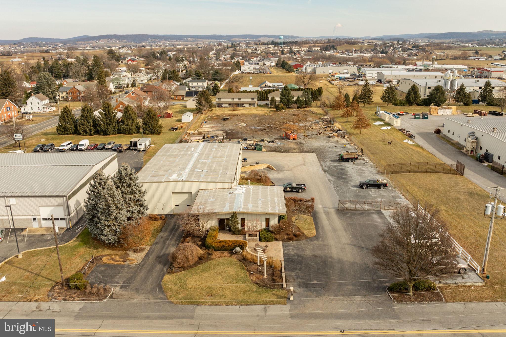 AUCTION PROPERTY. Auction date is Friday, April 11th @ 4PM. List price is opening bid price only and is not indicative of the final sale price. TERMS: 10% down day of auction, balance 60 days or before. Buyer pays both transfer taxes (2% of sale price). REAL ESTAT: Custom commercial building, steel fabrication/insulation 60x90 warehouse/shop w/gas forced air heat, 400 Amp 3 phase electric, (2) 12x14 overhead doors, 20’ ceiling, loading dock, 5,400 SF warehouse/shop area includes 12 T. Ben Pearson lift, additional 2,500 SF office area w/6 offices, reception room, large conference room w/kitchenette, mini split AC & heat, storage, utility rooms & 2 lavatories all on level & security fenced 2.4 ACRE lot w/public water & sewer, macadam paring area & custom paver patio entrance. Zoned Highway Commercial/Industrial use. Many varied permitted & special exception uses. NOTE: After 25 years, owners serious to sell real estate location of Clean Energy Maintenance. Ideal Convenient East Earl, Blue Ball, New Holland location. Low maintenance facility & reasonable taxes. Terms 10% down, balance 60 days or before. Personal inspection by appointment or Open Houses, Saturday, March 22, 29 & April 5 from 1-4 PM.