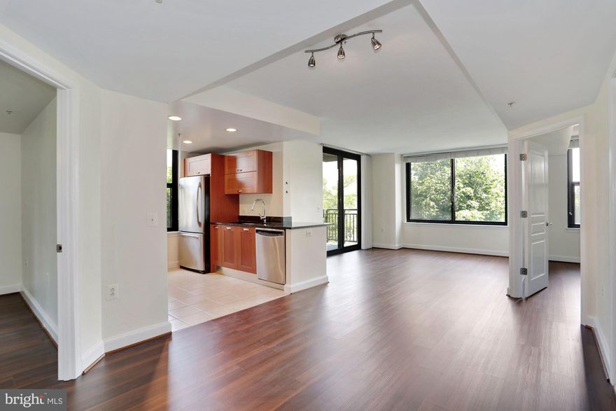 Located directly across from metro.  Brand new floors and freshly painted.  Open layout,  balcony, 2 bed 2 bath with tons of storage space.  Two assigned parking spaces are located on the same level as the condo for added convenience. The community has 24/7 concierge, fitness center, party room, swimming pool, guest suite and guest parking.   Easy commute to beltway/95.  Just a few metro stops to shopping and dining.  Available immediately.
