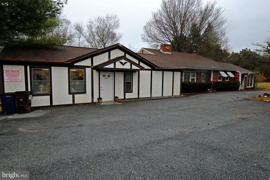 Mixed-use property on Liberty Rd. 3-bedroom apartment with large beauty salon. Live in one and rent the other, or live right next door to your business! Apartment currently rented, lease expires in May 2018.