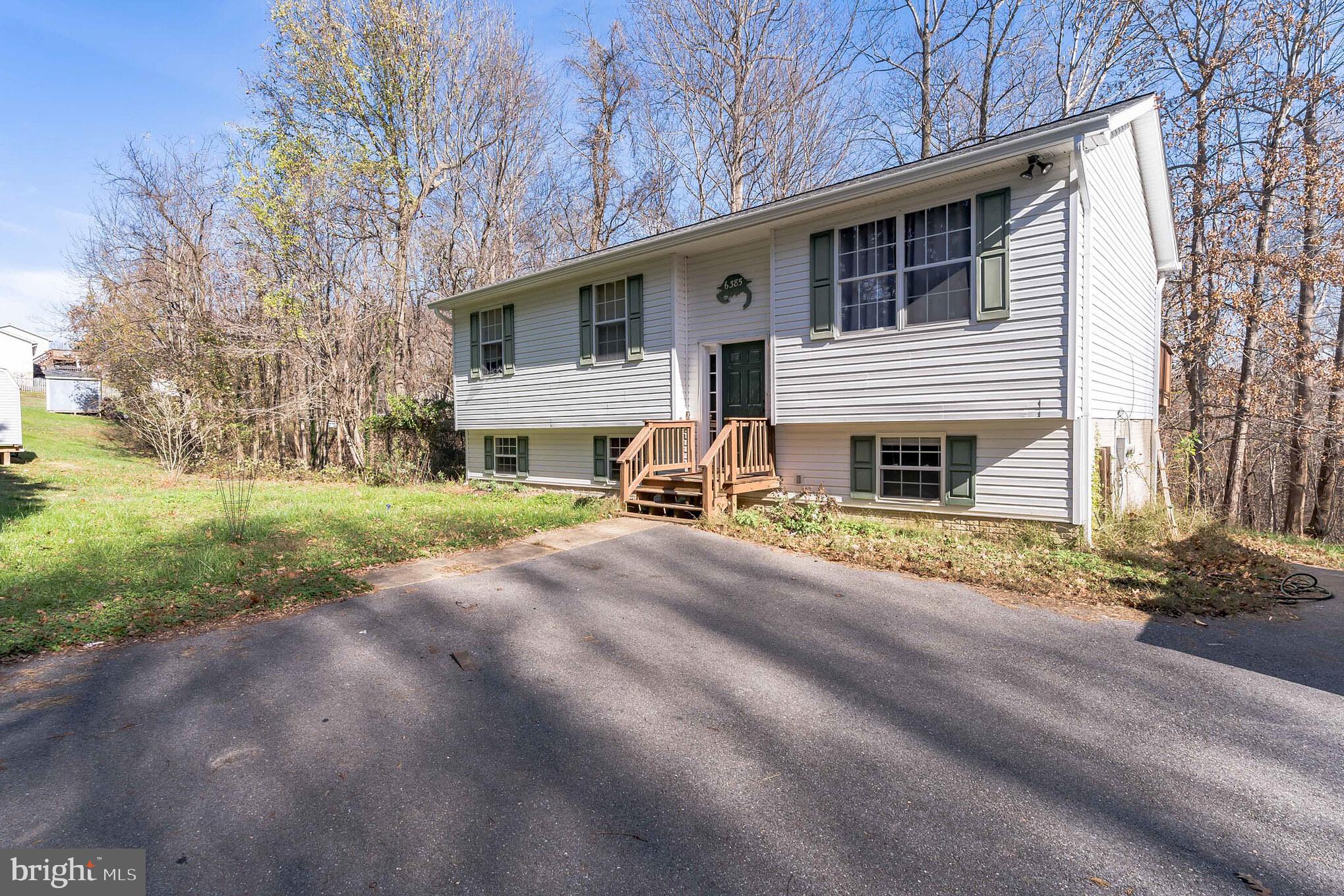 4 bedroom 2bathroom home with a short drive to Brownie Beach, the boardwalk, shops, and more! Enjoy a light and bright living room that flows in to the kitchen with plenty of counter space, cabinet space and access to the deck, the perfect place to enjoy your morning. Main level includes 3 bedroom and 2 baths all include carpet and ceiling fans. The walk out basement is perfect for rec room or additional living space and includes bar and additional bedroom with rough in for a 3rd bath. The back yard is spacious and is perfect for warm weather entertaining! Close to beaches, marina, casino, restaurants, water park, & great schools! Easy commute to D.C. JBA, & Solomons!