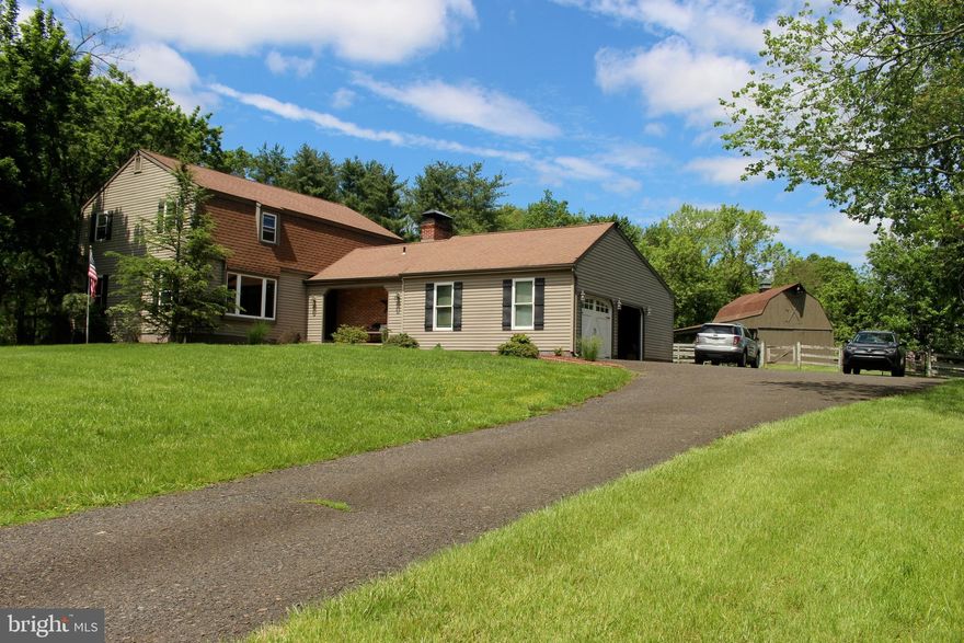 Welcome to Furlong – Buckingham Township! Bring the family and the horses to this inviting farmhouse in the heart of Bucks County. This versatile property features a custom built and updated home on almost 4 acres on picturesque Creek Road in the award-winning Central Bucks School District. 
The two story 20 X 30 barn has several matted stalls, ample storage, water, electric and hayloft. Fenced paddock areas open to 3 grazing pastures. A separate 10x20 equipment storage shed within the paddock area can be home to additional barnyard friends!
This charming home offers 3 bedrooms, 2 ½ baths, a large family room with wood burning stove, modern eat in kitchen with center island, formal dining room and home office or formal living room with views of the private fishing pond. A mud room, supporting plenty of storage closets, powder room and large laundry room provides generous space when entering from the oversized two car garage. The garage features workspace, attic storage and supports a utility sink area for prepping barn meals or washing up after barn visits. The portable generator hooks up in the garage and an approved main breaker cut-out in panel, allows the entire house to be powered by generator if needed. 
The current owner invested in many upgrades after purchase in 2006 including a new heater, 2 new central AC units, new roof, new windows, new siding, and new garage doors. All new hardwood and tile floors were installed except for the original family room hardwood floors. The updated kitchen features granite countertops, built-in stainless-steel appliances, and spacious hardwood cabinets. A large, covered patio directly off the kitchen has multiple ceiling fans to keep you comfortable while enjoying views of the barnyard animals or bonfire gatherings. 
The basement has been partially finished to create an additional 870 sq feet of recreation area plus a separate storage area and mechanical room. Newer Bilko doors and concrete steps lead to the rear yard near the covered patio. 
The large master bedroom has an updated master bath and walk-in closet. Two additional bedrooms with generous closets as well as full bath, two towel closets and large cedar closet round out the second floor. A drop-down ladder in the hallway leads to an attic that is partially floored for storage.
This home is a rare beauty, don’t miss out on the opportunity to make this your new dream home in a wonderful community!
