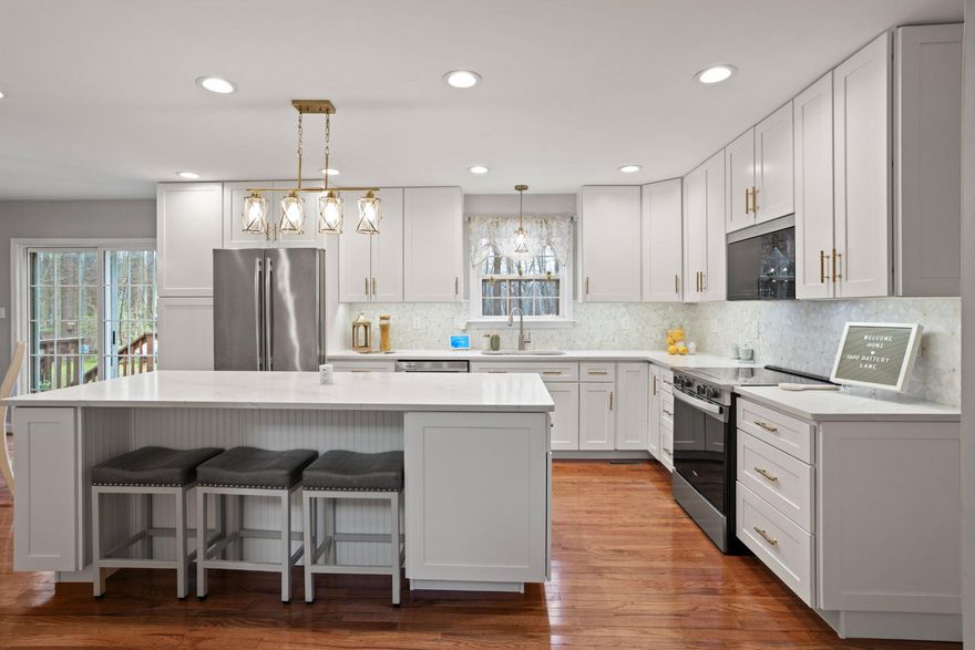 Welcome to your private retreat, nestled at the end of a serene cul-de-sac in Victoria Station—one of North Calvert’s most sought-after communities. Enjoy the large custom-built patio, firepit, water features, and landscape lighting throughout, (connected for easy access) wired to a switch.  Step inside the open foyer and be captivated by the new 2025 gourmet kitchen, featuring quartz countertops, stainless steel appliances, a stunning backsplash, and elegant finishes. The oversized island offers ample space for serving, cooking, and entertaining, along with a retractable charging station built right into the quartz countertop. The kitchen also includes a beverage bar with instant-hot and filtered water access, a built-in beverage fridge, a tastefully designed indoor herb garden planters, perfect for growing your own herbs and spices year-round. The main level features a half bath, a custom office space ideal for working from home or homeschooling, a formal sitting room overlooking the wraparound, a dining room with door access to the back deck, and a spacious family room with a glass enclosed gas fireplace and custom built-ins. Upstairs, the primary suite offers a large walk-in closet spacious enough for two featuring automatic lighting as you enter and a touch lighted full length mirror. Three additional generously sized bedrooms and closets, as you continue through this spacious upstairs, and a full hall bathroom provide plenty of room for a growing family. The hall bath was customized to separate the shower area from the vanity, allowing two people to use the space at the same time. UPPER LEVEL LAUNDRY adds everyday convenience. The fully finished basement offers excellent potential for multigenerational living, featuring a living room, playroom/craft room/office, large bedroom, full bathroom, and a kitchenette serving area with access directly to the backyard patio. The basement level entry creates a private entrance opportunity to access the lower level without going through the main entrance of the home. Situated in a cul-de-sac on 1.02 acres backing to mature trees, the property also includes a beautiful fenced garden, established and ready for your homegrown vegetables and more. Welcome to the highly sought-after neighborhood of Victoria Station, a beautiful lake community featuring tennis courts, a basketball court, playground, walking path, benches, and a lake for morning or evening strolls, as well as catch-and-release fishing. A 2-car garage and ample driveway parking provides plenty of room for multiple vehicles, as well as space for a trailer or boat. More upgrades to include Lawn Sprinkler System and customized to water the gardens, Gas Water Heater was replaced in 2024/25, Windows by Thompson Creek 2011, HVAC 2010, Radon Mitigation 2021, Roof 2011, Gutters & Guards 2011, Bright custom lighting throughout this home including lighting in all bedroom and foyer closets. The yard is surrounded by a Dog-Watch buried Hidden Fence (dog collar included) allowing pets free run of the property. (25.1 miles) to Joint Base Andrews, (41.4 miles) to Pax River Naval Station, (30.1 miles) to Naval Academy Annapolis, MD, (40.6 miles) to Fort Meade Main Gate, (35.7) miles to Pentagon. Located just minutes from North Beach, Chesapeake Beach, Herrington Harbour North & South, North Beach Boardwalk, and a variety of restaurants, shopping, parks and recreation. Welcome to Calvert County and all it has to offer!