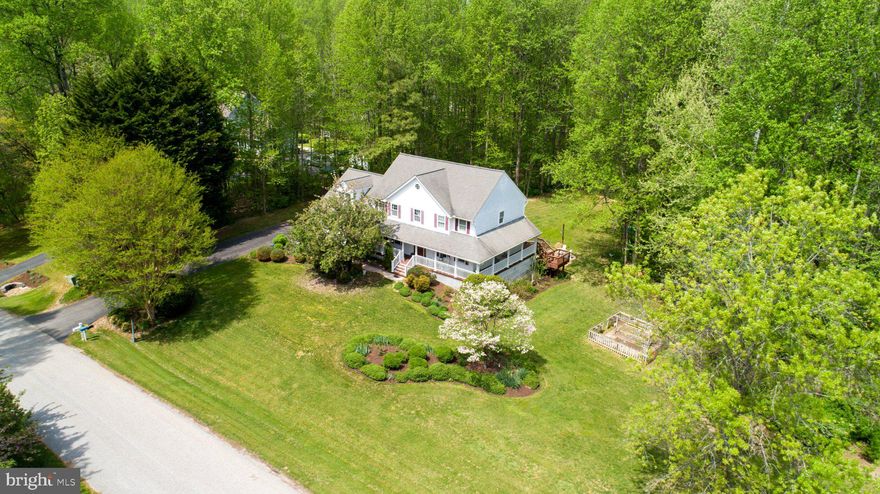 Welcome to the highly sought-after neighborhood of Victoria Station, a beautiful lake community featuring tenniscourts, a basketball court, playground, walking path, benches, and a lake for morning or evening strolls, as well as catch-and-release fishing. Welcome HOME to Victoria Station’s-1860 Battery Lane, a beautifully landscaped home with a backyard oasis perfect for entertaining and hosting celebrations of all kinds. Enjoy the large custom-built patio, firepit, water features, and landscape lighting throughout, (connected for easy access) wired to a switch.  Step inside the open foyer and be captivated by the new 2025 gourmet kitchen, featuring quartz countertops, stainless steel appliances, a stunning backsplash, and elegant finishes. The oversized island offers ample space for serving, cooking, and entertaining, along with a retractable charging station built right into the quartz countertop. The kitchen also includes a beverage bar with instant-hot and filtered water access, a built-in beverage fridge, a tastefully designed indoor herb garden planters, perfect for growing your own herbs and spices year-round. The main level features a half bath, a custom office space ideal for working from home or homeschooling, a formal sitting room overlooking the wraparound, a dining room with door access to the back deck, and a spacious family room with a glass enclosed gas fireplace and custom built-ins. Upstairs, the primary suite offers a large walk-in closet spacious enough for two featuring automatic lighting as you enter and a touch lighted full length mirror. Three additional generously sized bedrooms and closets, as you continue through this spacious upstairs, and a full hall bathroom provide plenty of room for a growing family. The hall bath was customized to separate the shower area from the vanity, allowing two people to use the space at the same time. UPPER LEVEL LAUNDRY adds everyday convenience. The fully finished basement offers excellent potential for multigenerational living, featuring a living room, playroom/craft room/office, large bedroom, full bathroom, and a kitchenette serving area with access directly to the backyard patio. The basement level entry creates a private entrance opportunity to access the lower level without going through the main entrance of the home. Situated in a cul-de-sac on 1.02 acres backing to mature trees, the property also includes a beautiful fenced garden, established and ready for your homegrown vegetables and more. A 2-car garage and ample driveway parking provides plenty of room for multiple vehicles, as well as space for a trailer or boat. More upgrades to include Lawn Sprinkler System and customized to water the gardens, Gas Water Heater was replaced in 2024/25, Windows by Thompson Creek 2011, HVAC 2010, Radon Mitigation 2021, Roof 2011, Gutters & Guards 2011, Bright custom lighting throughout this home including lighting in all bedroom and foyer closets. The yard is surrounded by a Dog-Watch buried Hidden Fence (dog collar included) allowing pets free run of the property. (25.1 miles) to Joint Base Andrews, (41.4 miles) to Pax River Naval Station, (30.1 miles) to Naval Academy Annapolis, MD, (40.6 miles) to Fort Meade Main Gate, (35.7) miles to Pentagon. Located just minutes from North Beach, Chesapeake Beach, Herrington Harbour North & South, North Beach Boardwalk, and a variety of restaurants, shopping, parks and recreation. Welcome to Calvert County and all it has to offer!